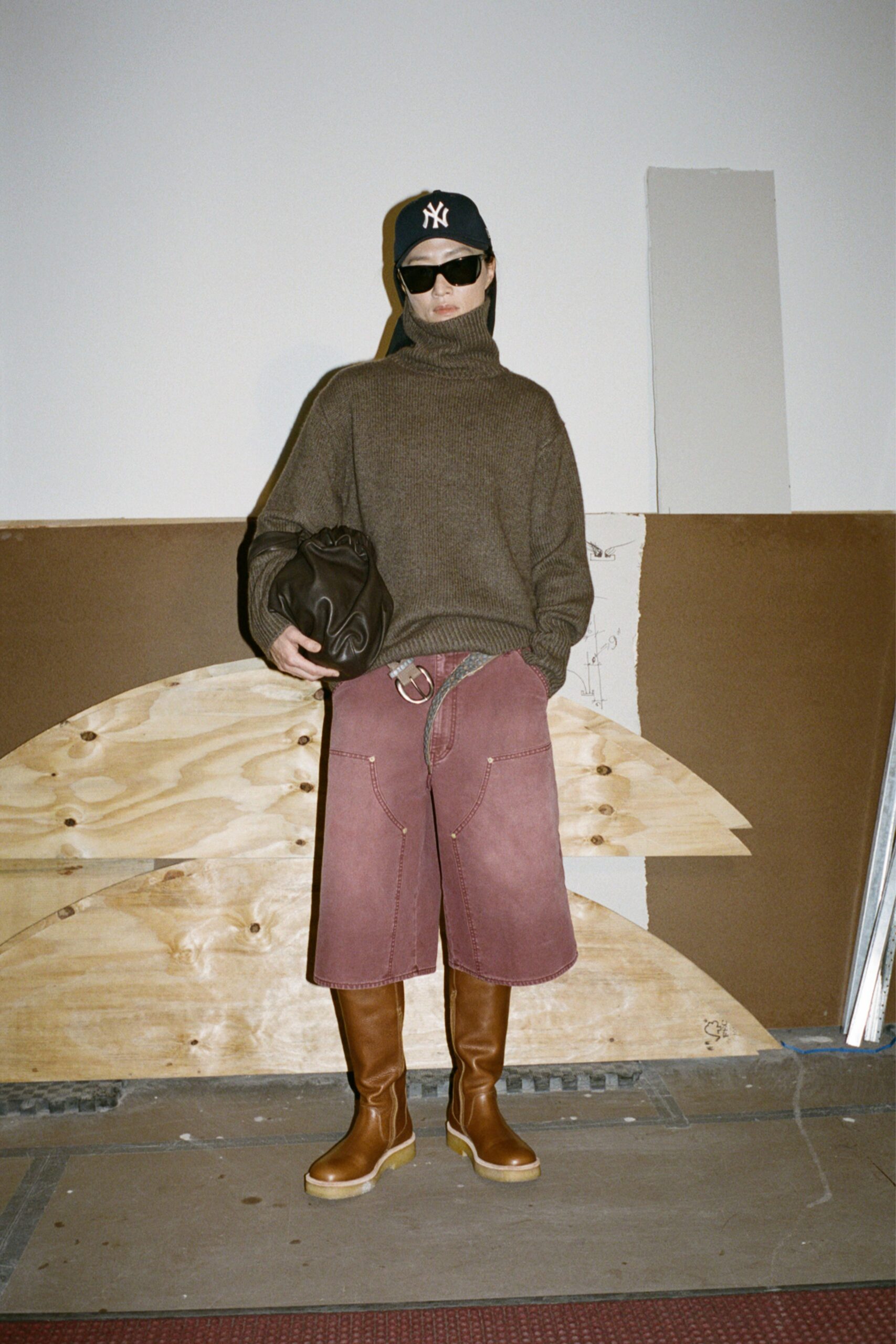 brown wool turtleneck sweater with pink shorts