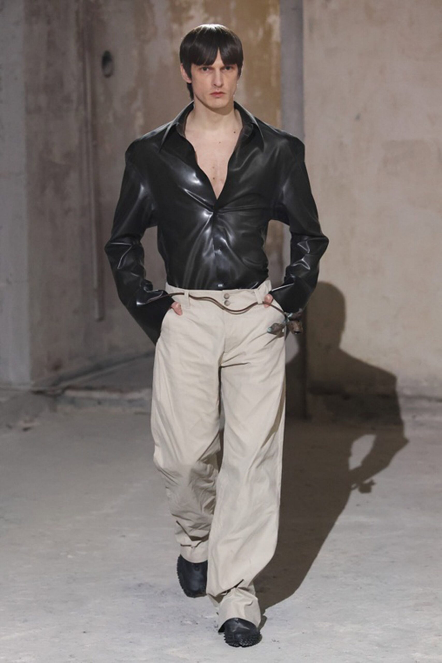 black leather shirt beige pants