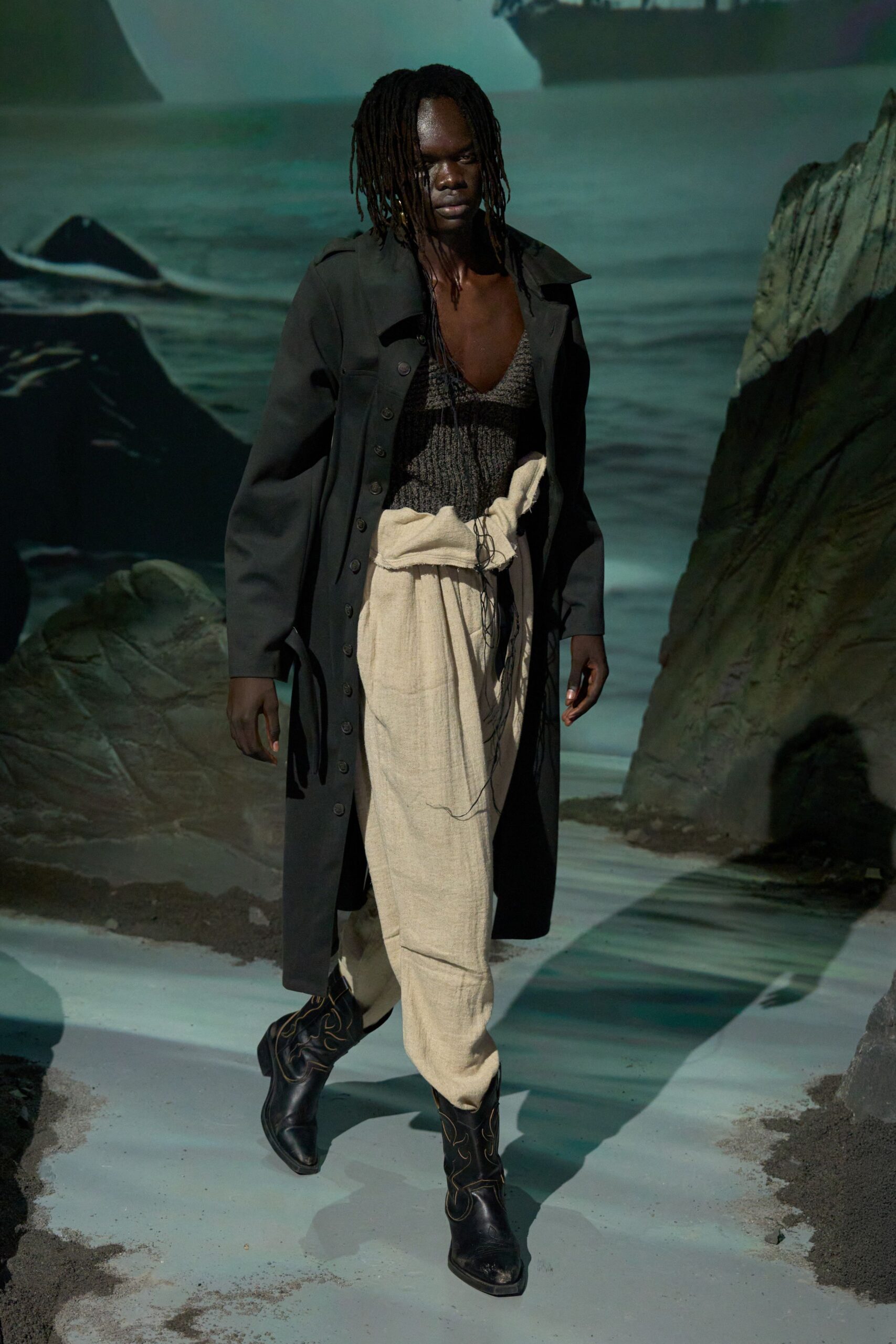 black coat beige pants black boots