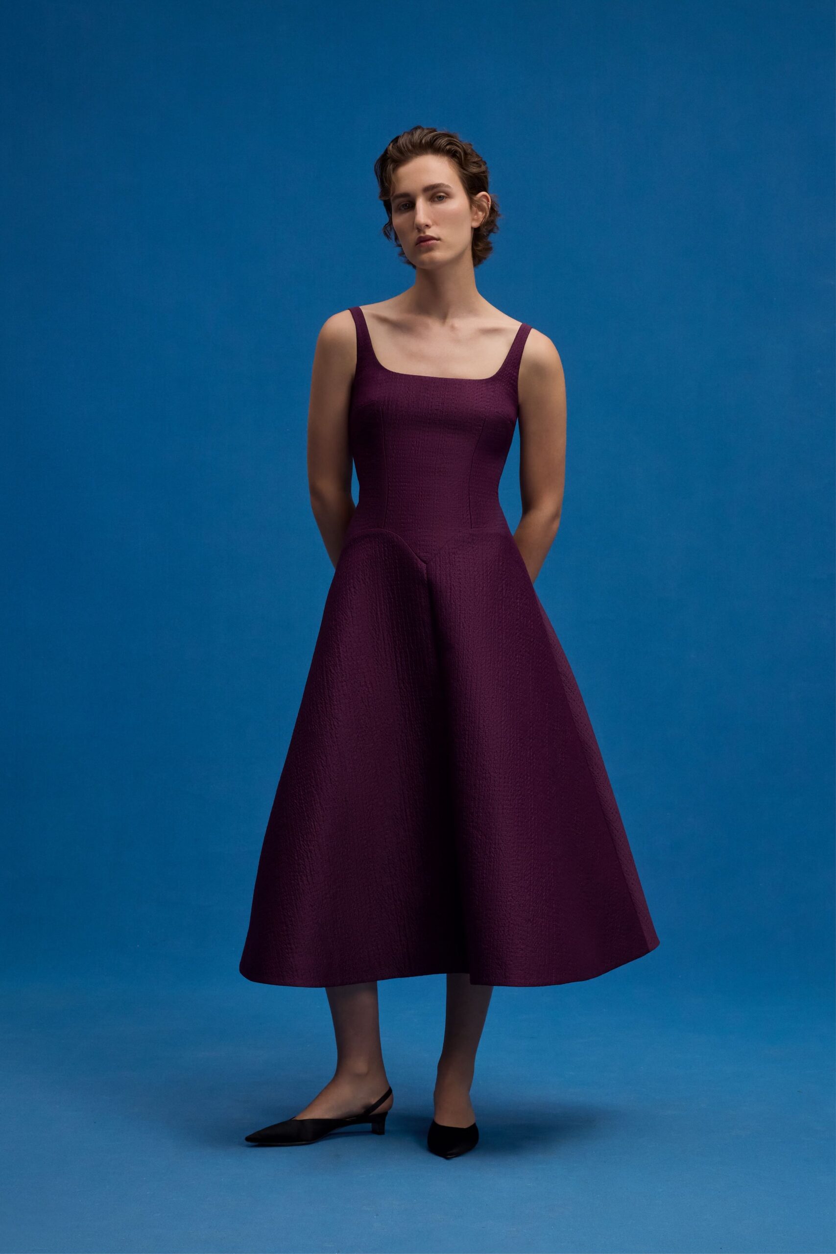 purple midi dress with black shoes