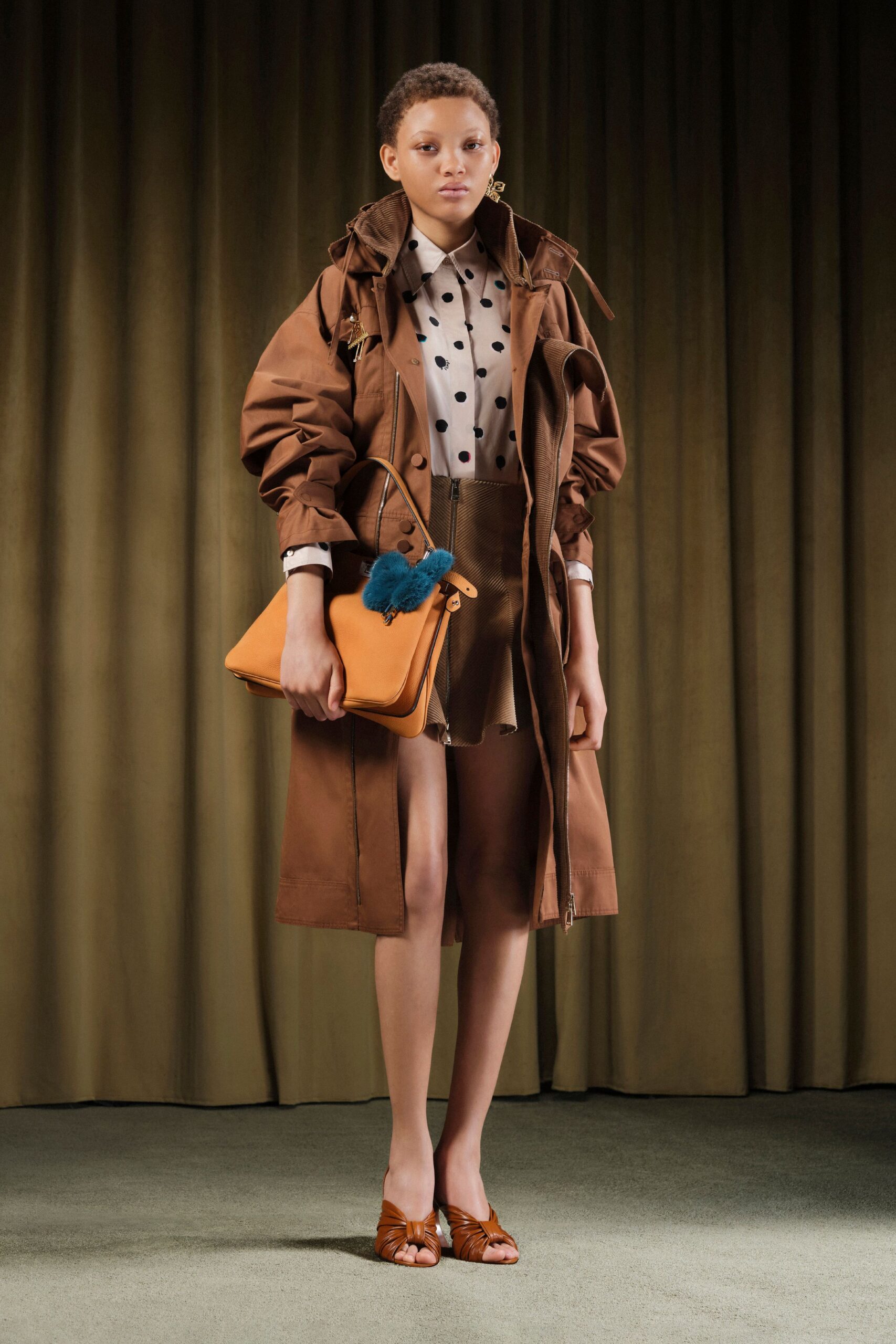 brown coat with polka-dot shirt