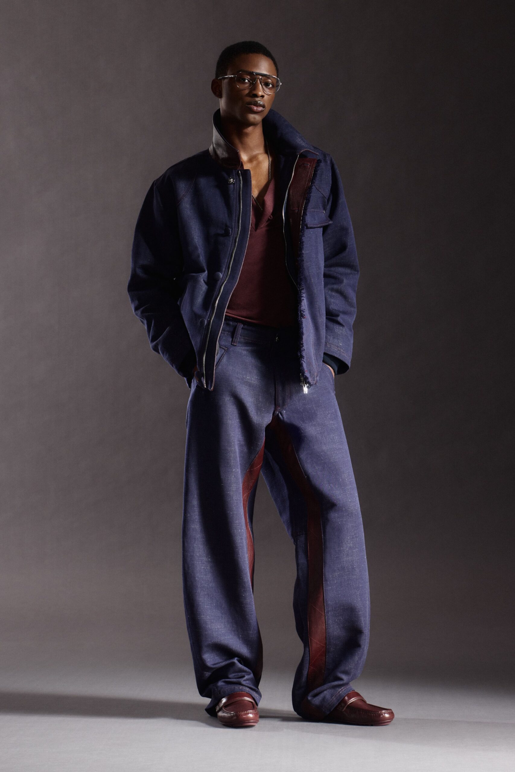 blue denim jacket with maroon shirt