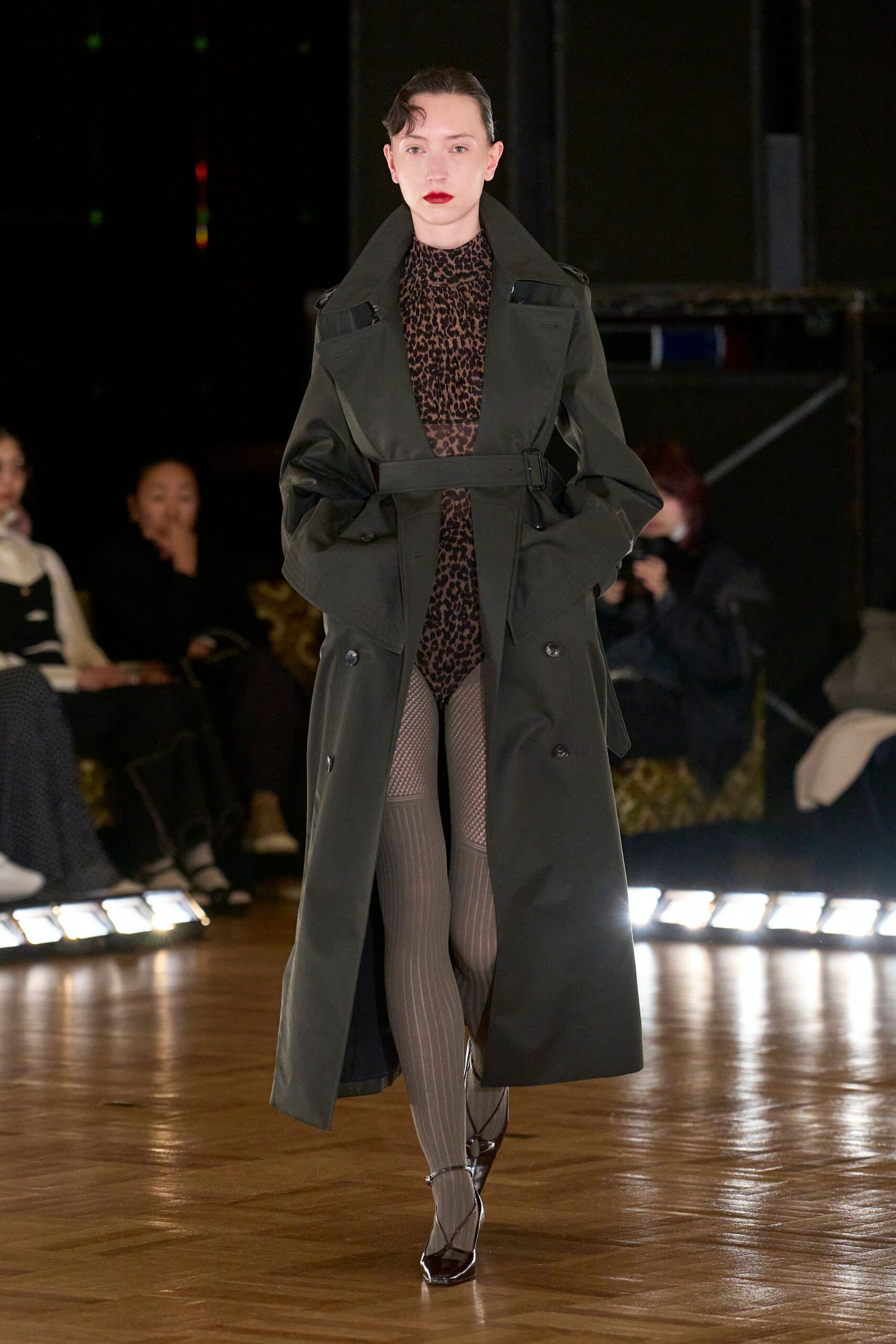 green trench coat with animal-print bodysuit