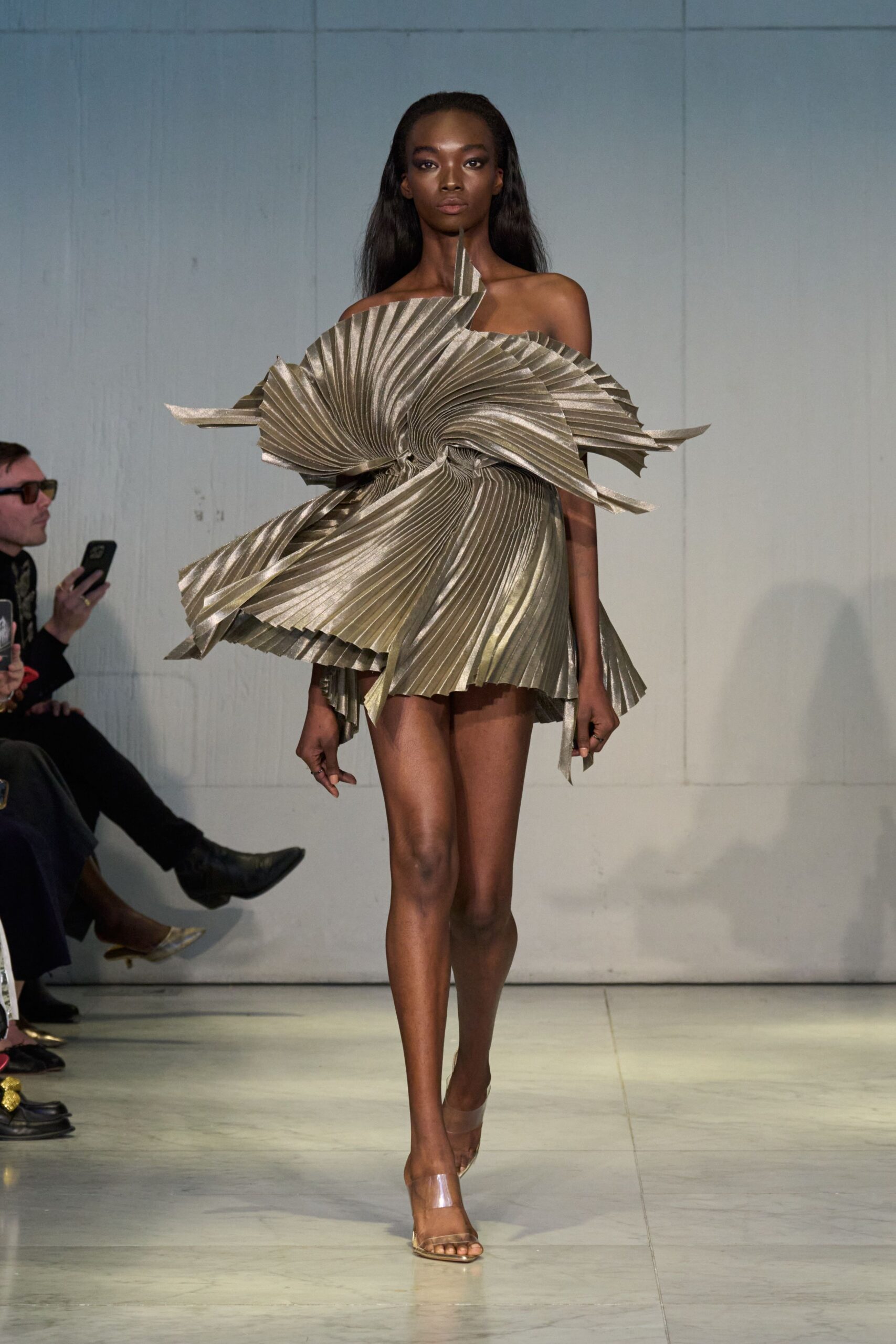 gold pleated mini dress with clear shoes