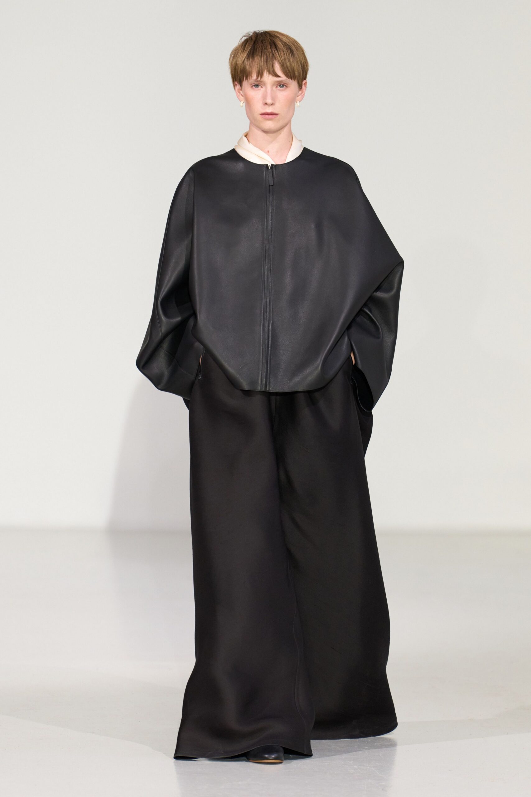 black leather oversized top and relaxed pants