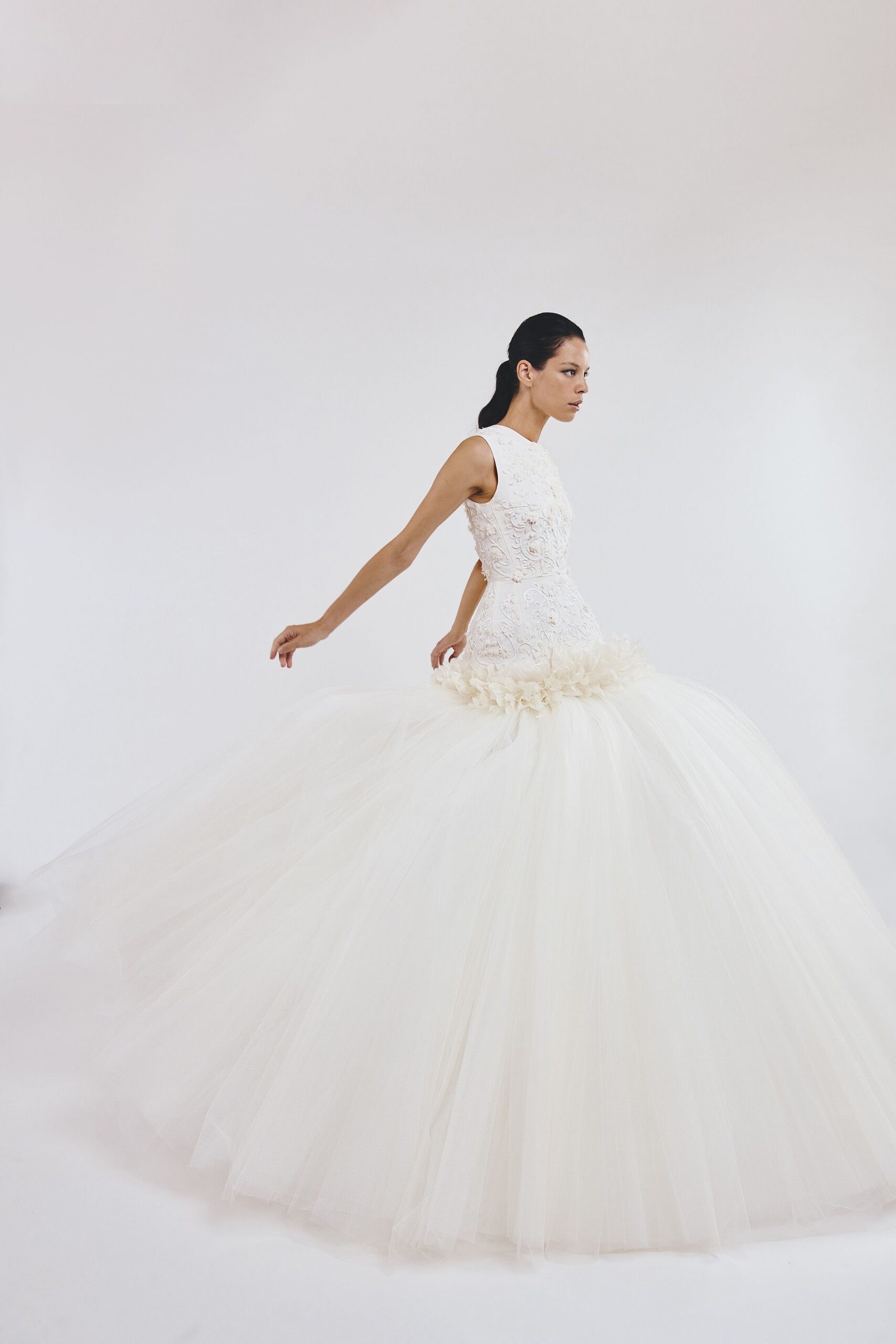 white sleeveless tulle gown
