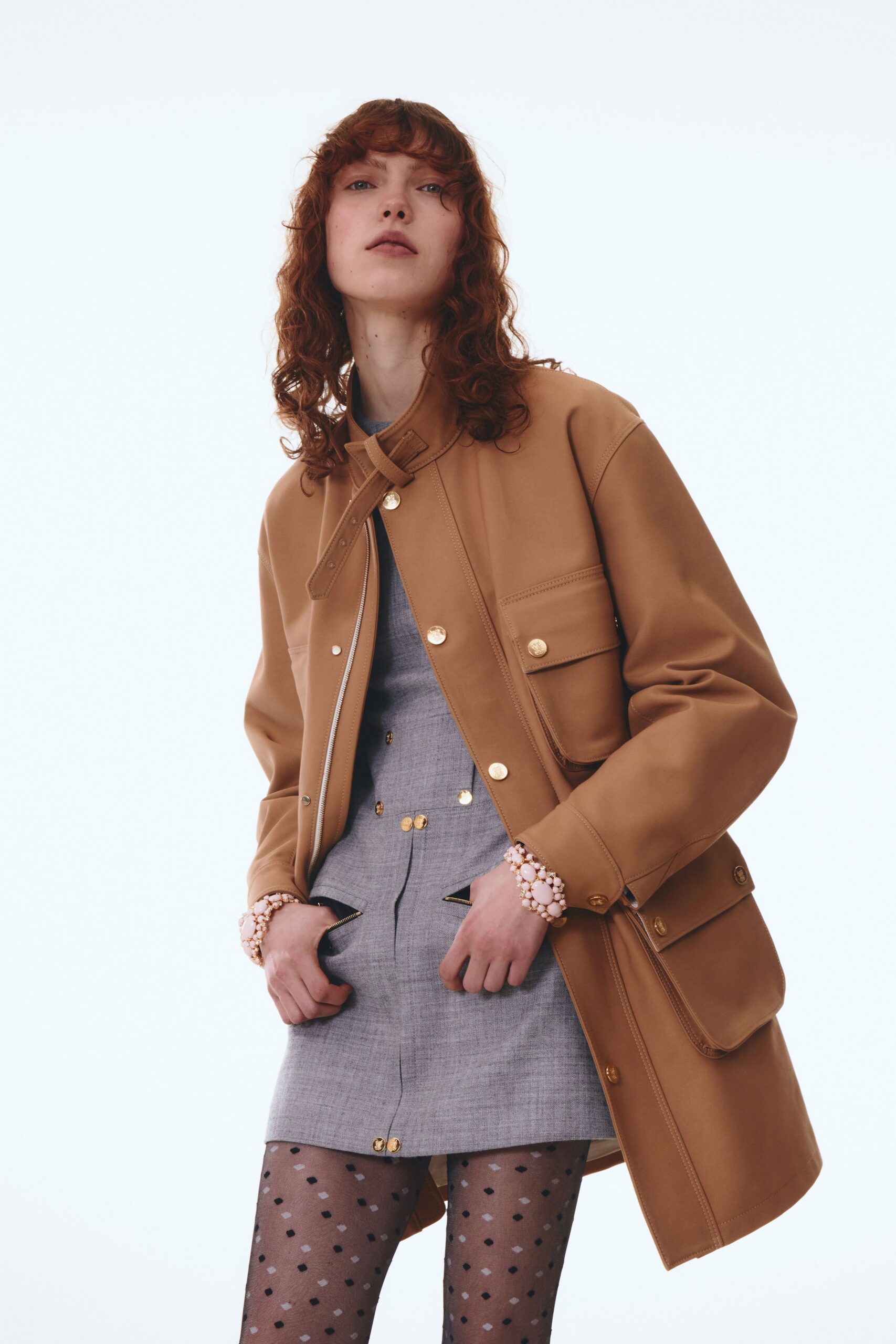 brown leather oversized jacket and gray mini dress