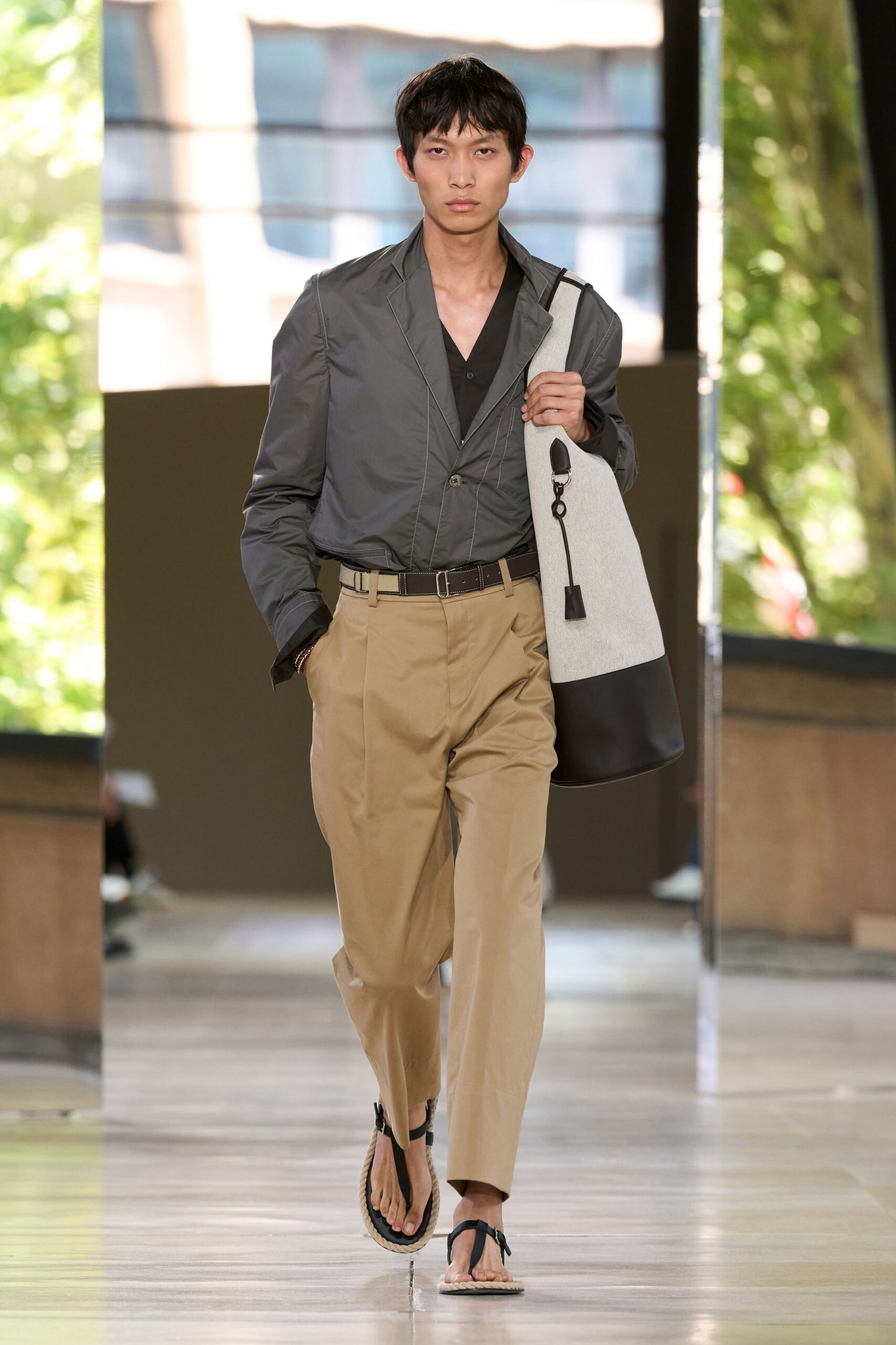 gray jacket black shirt beige pants