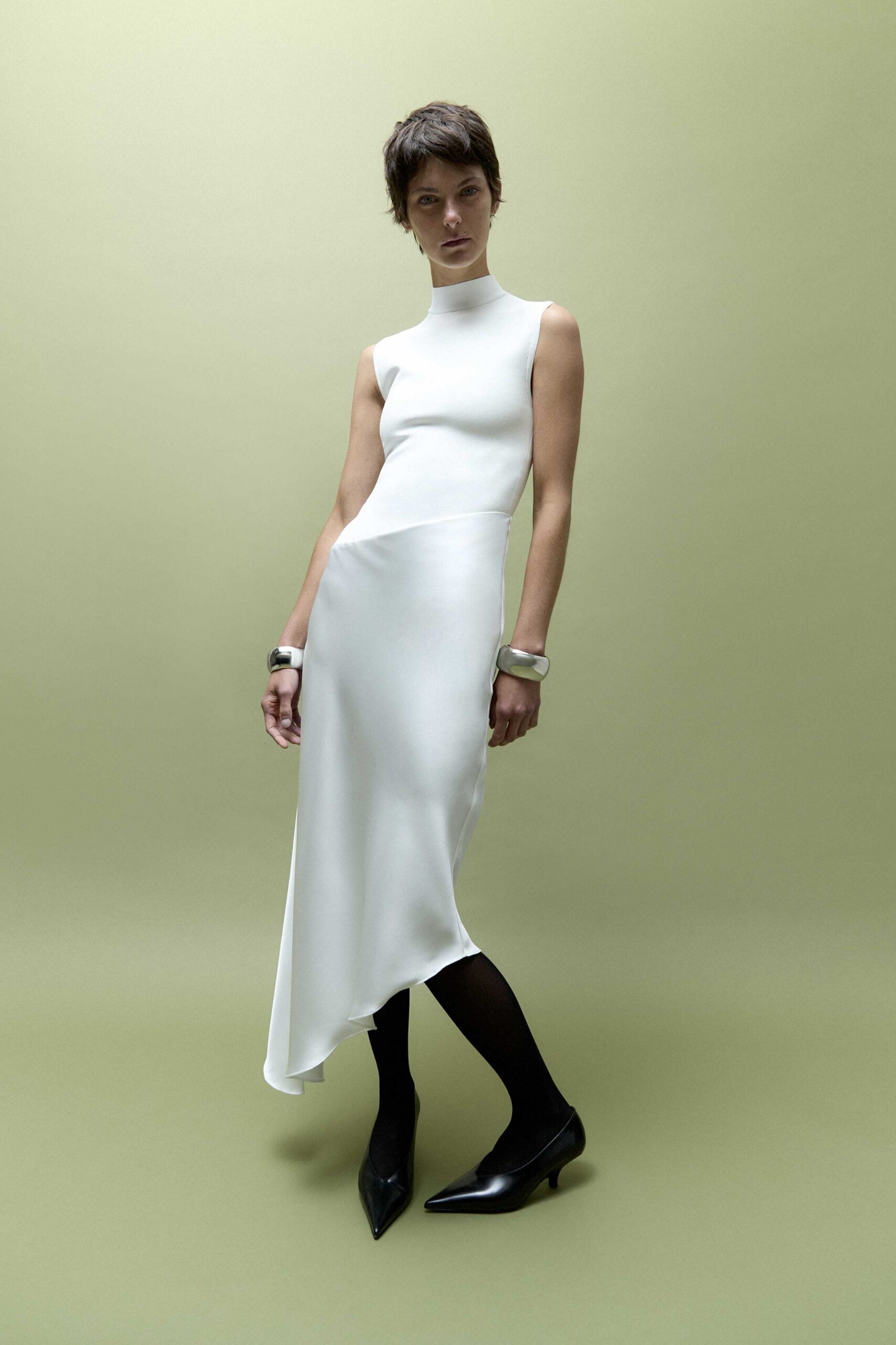 white silk sleeveless high-neck fitted flowing midi dress