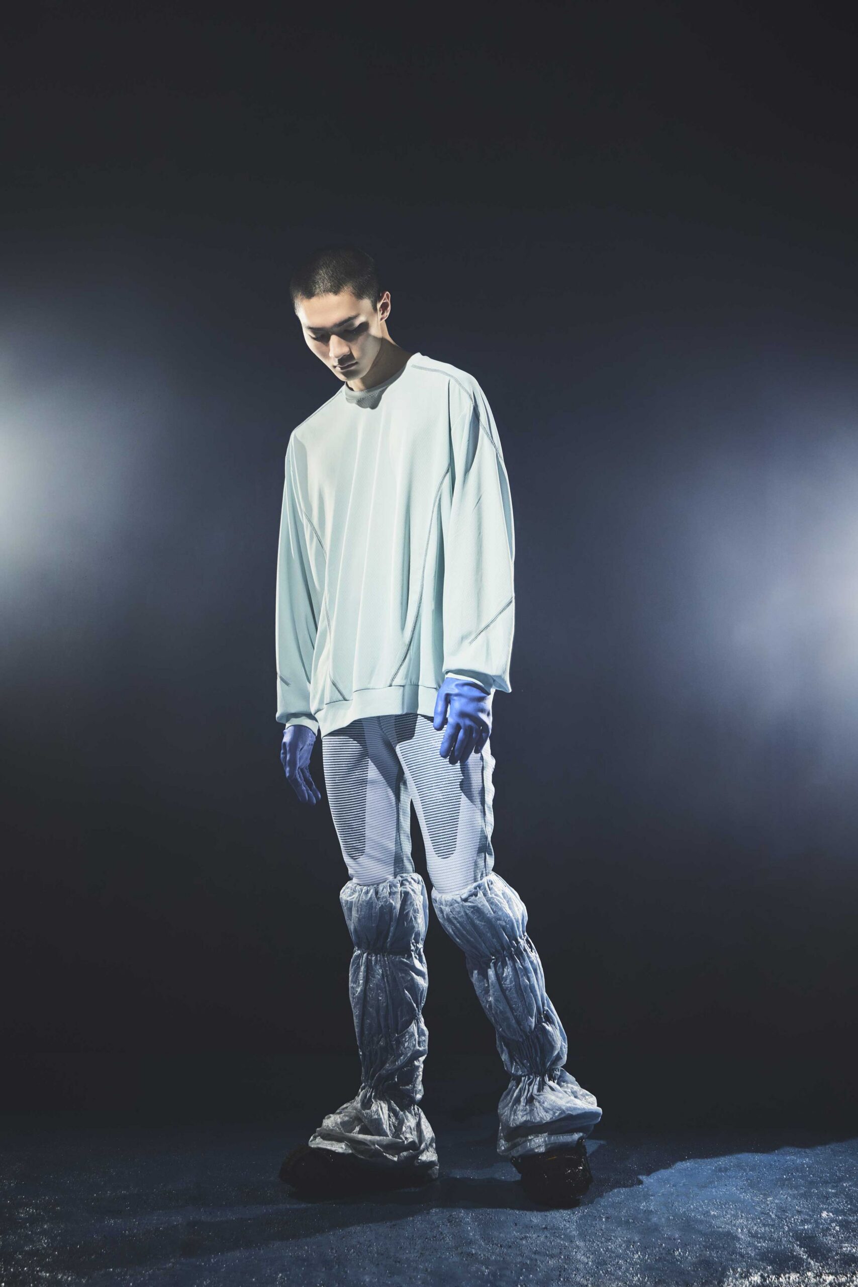 light blue oversized top with gray pants