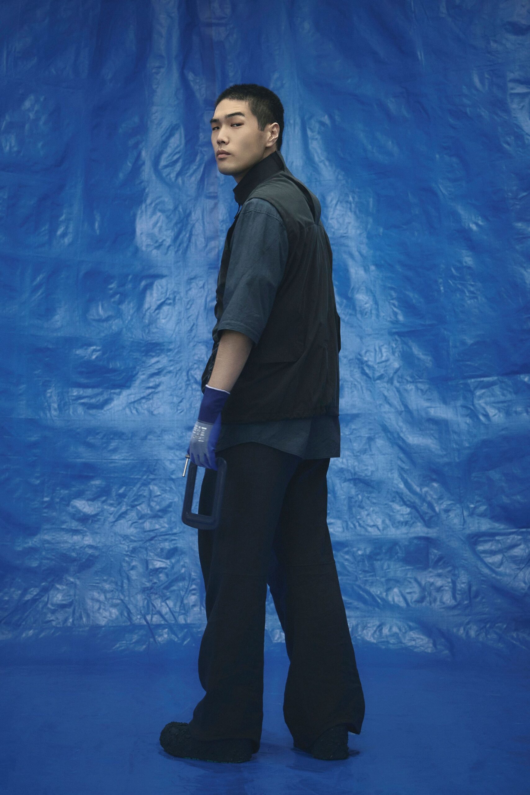 black vest blue shirt relaxed pants