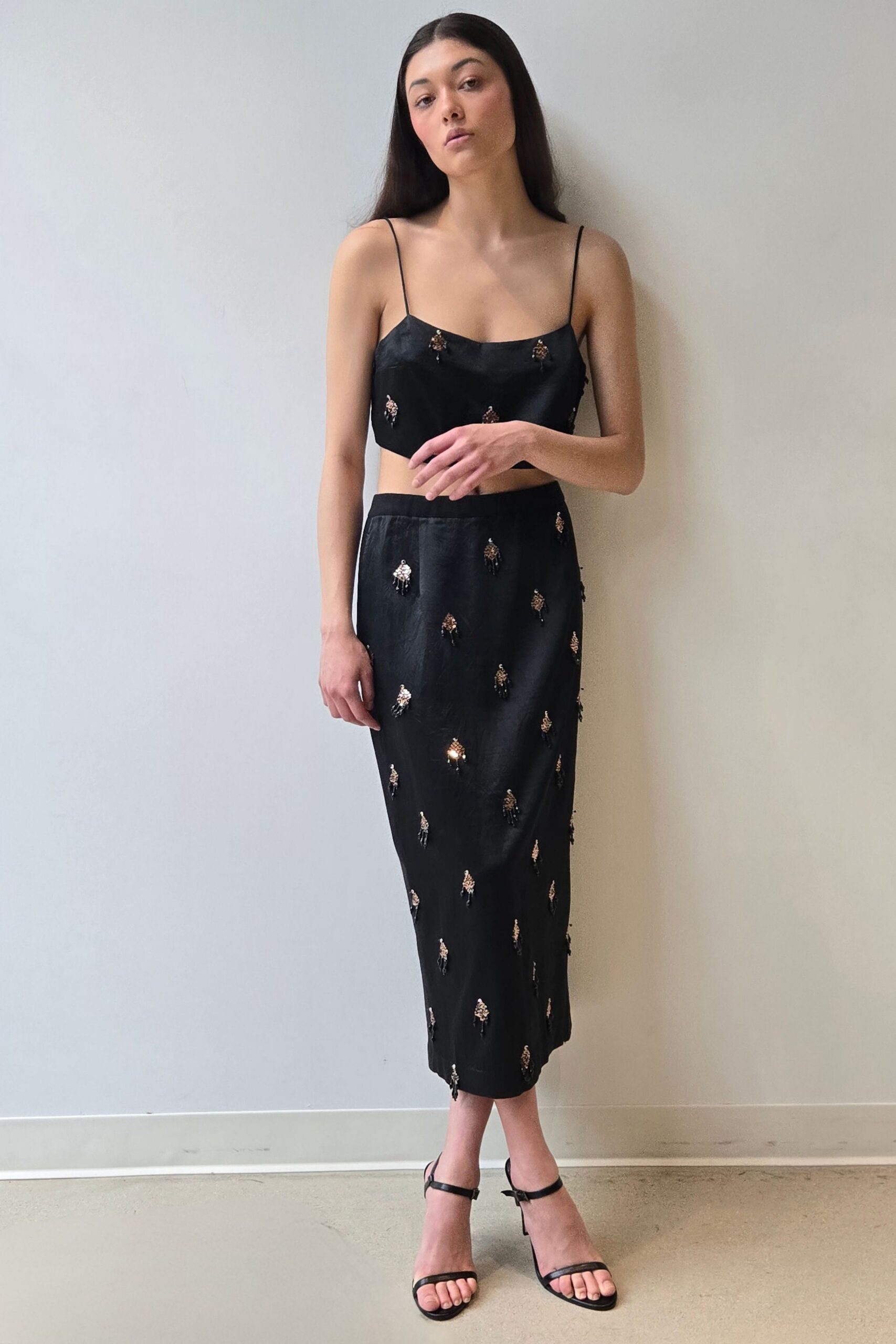 black silk sleeveless v-neck fitted embroidered straight-leg dress