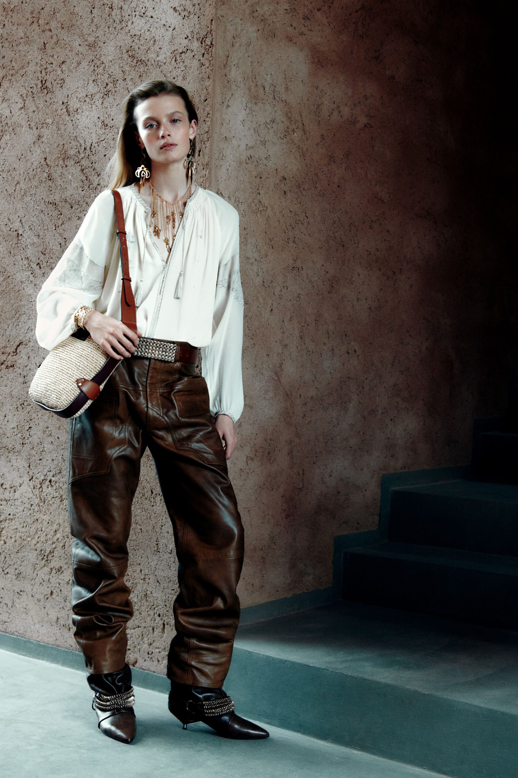 white silk blouse with brown leather pants