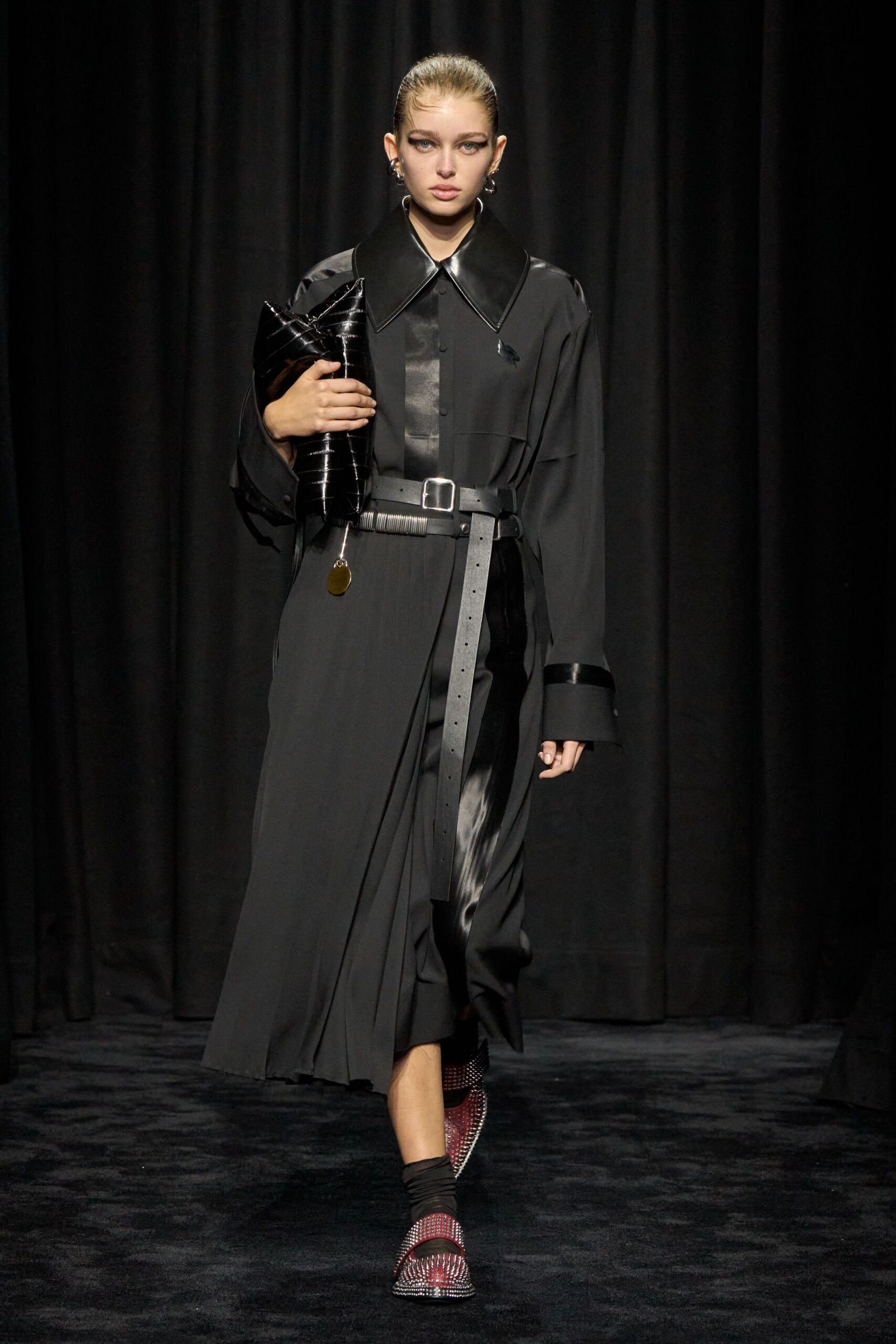 black pleated midi dress with red shoes