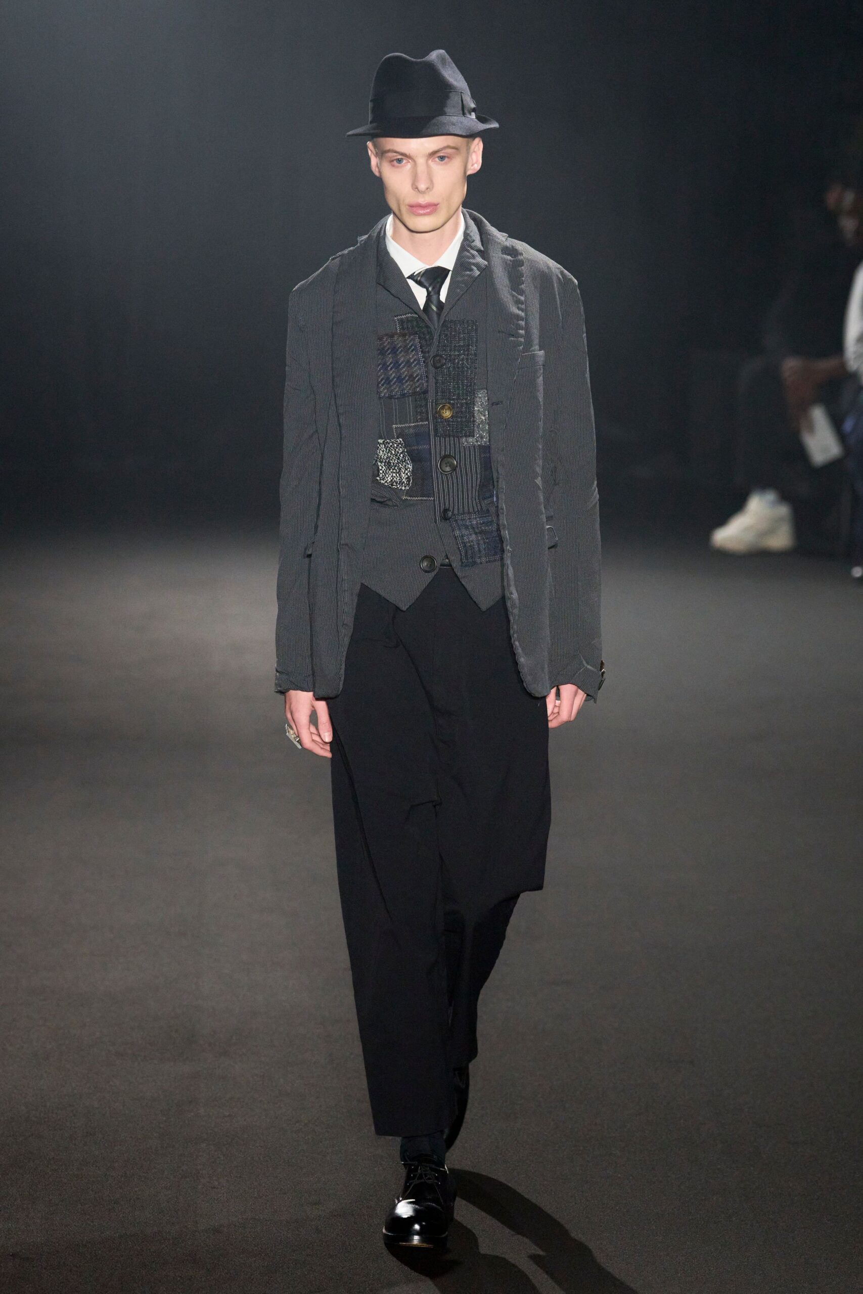 gray tailored suit with black vest
