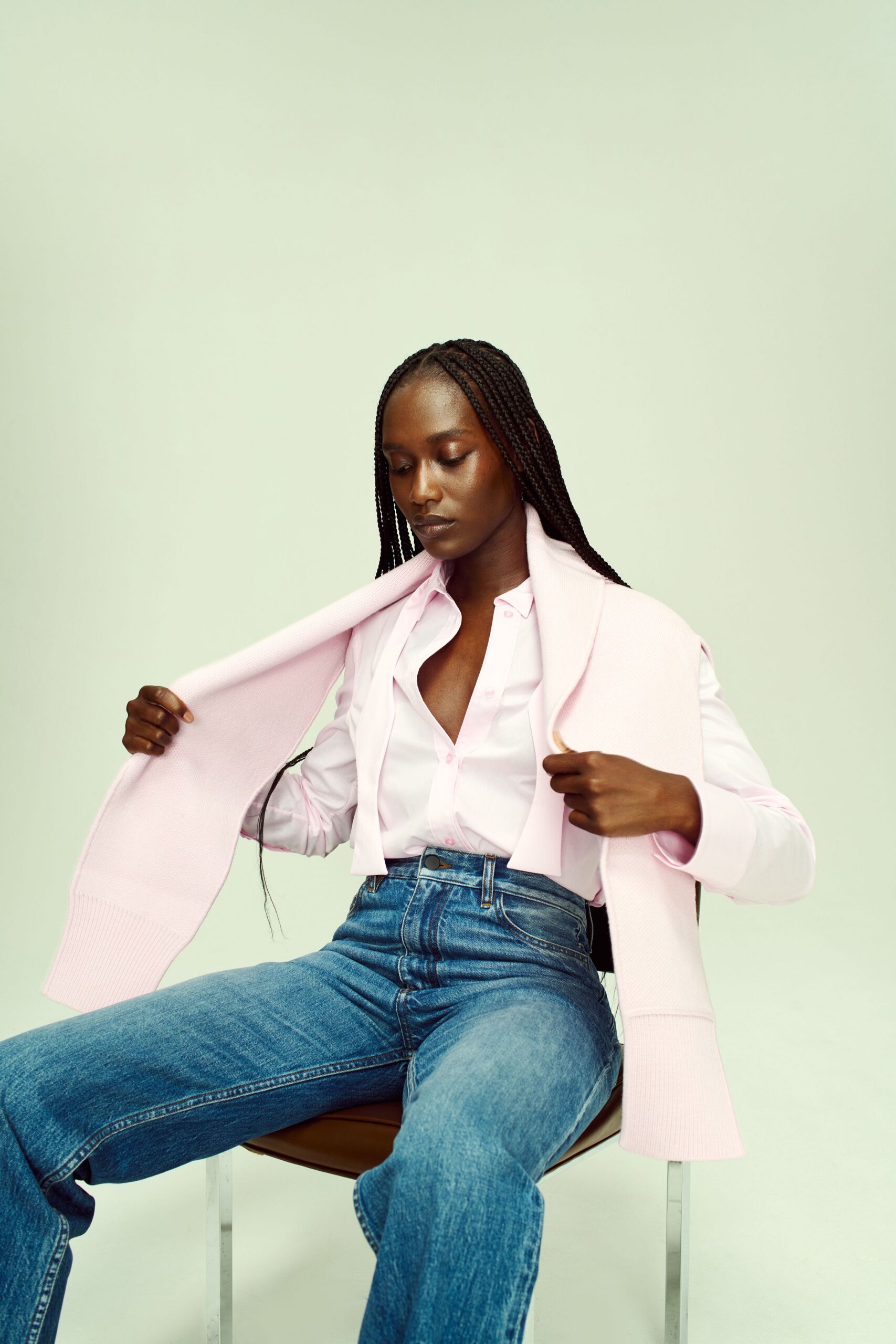 white shirt pink sweater blue jeans