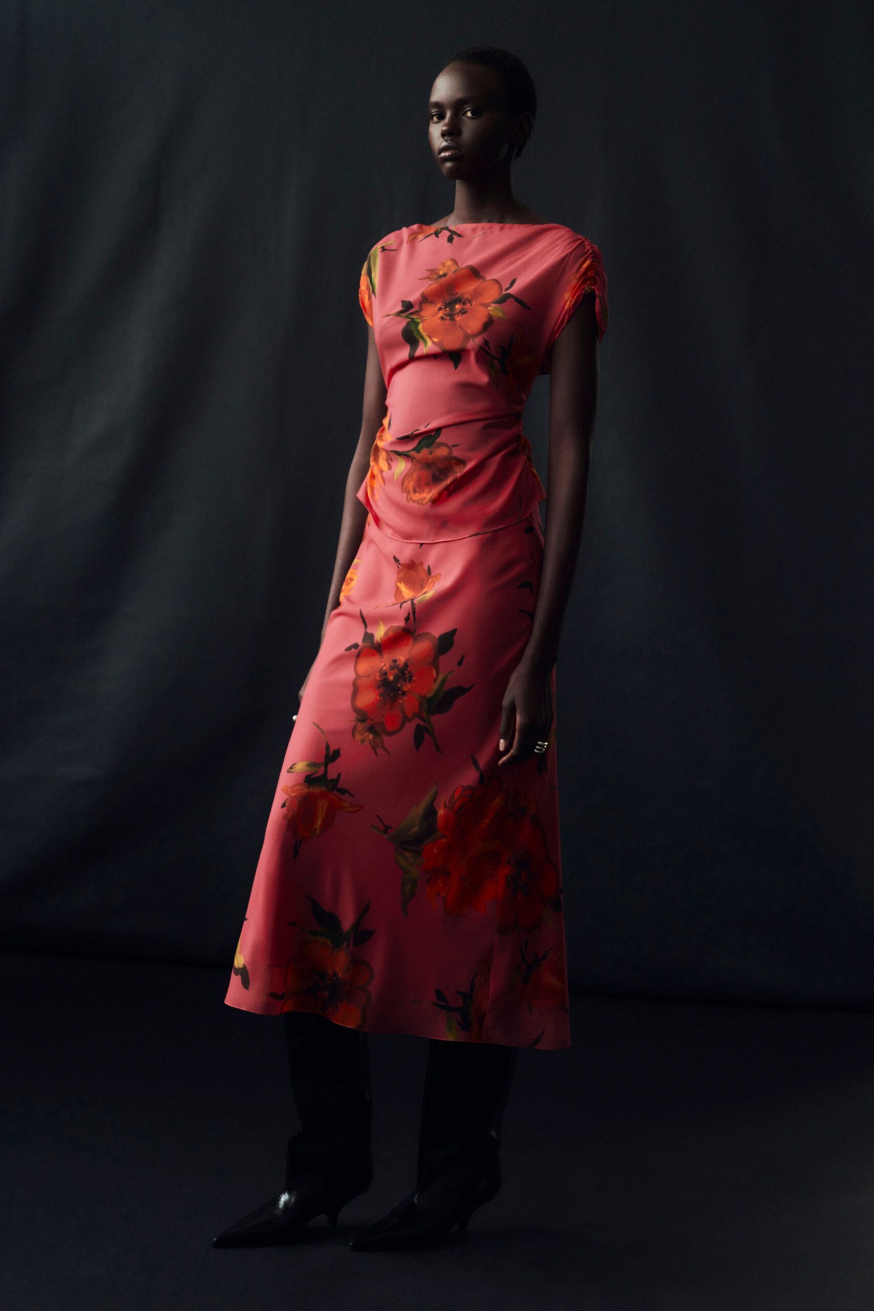 pink floral midi dress with black boots