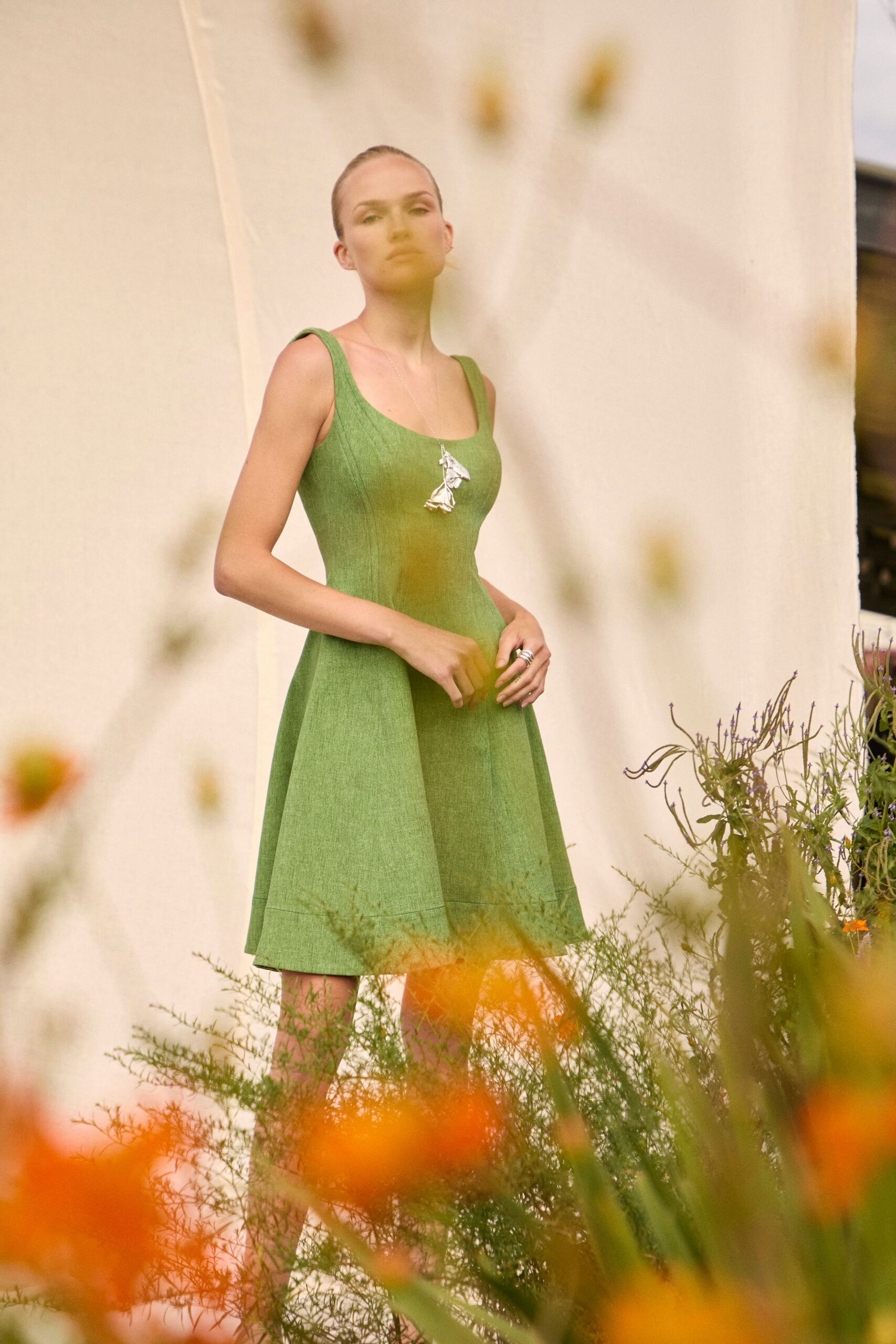 green fitted sleeveless dress