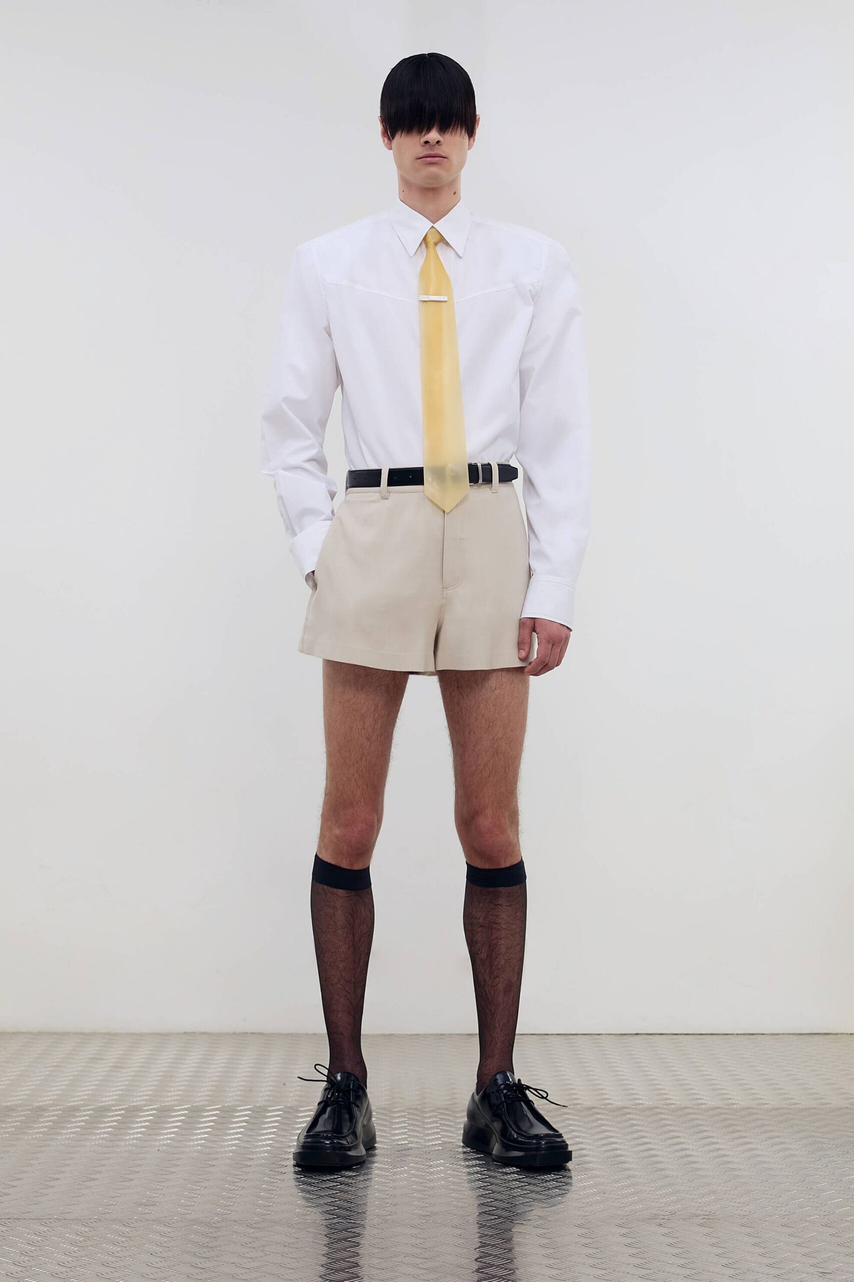 white shirt beige shorts