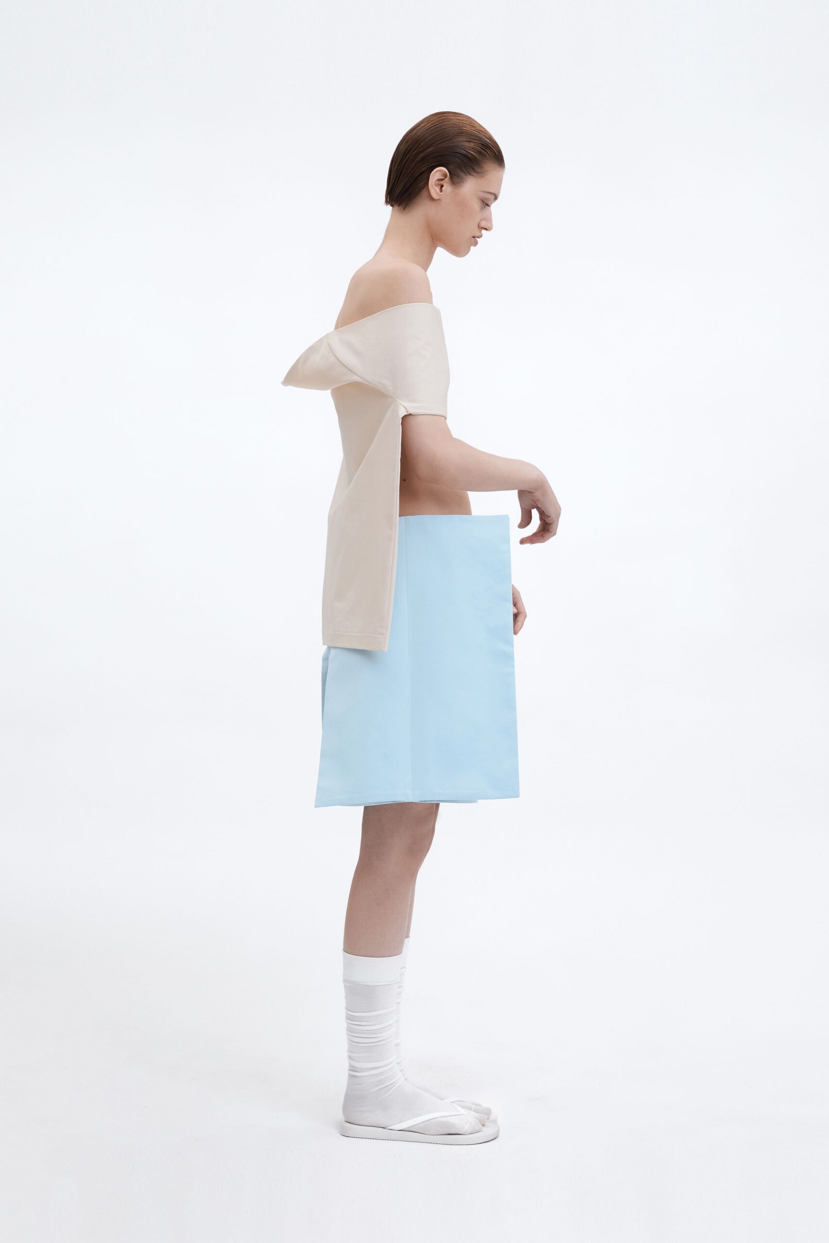 beige vinyl off-shoulder top with blue skirt