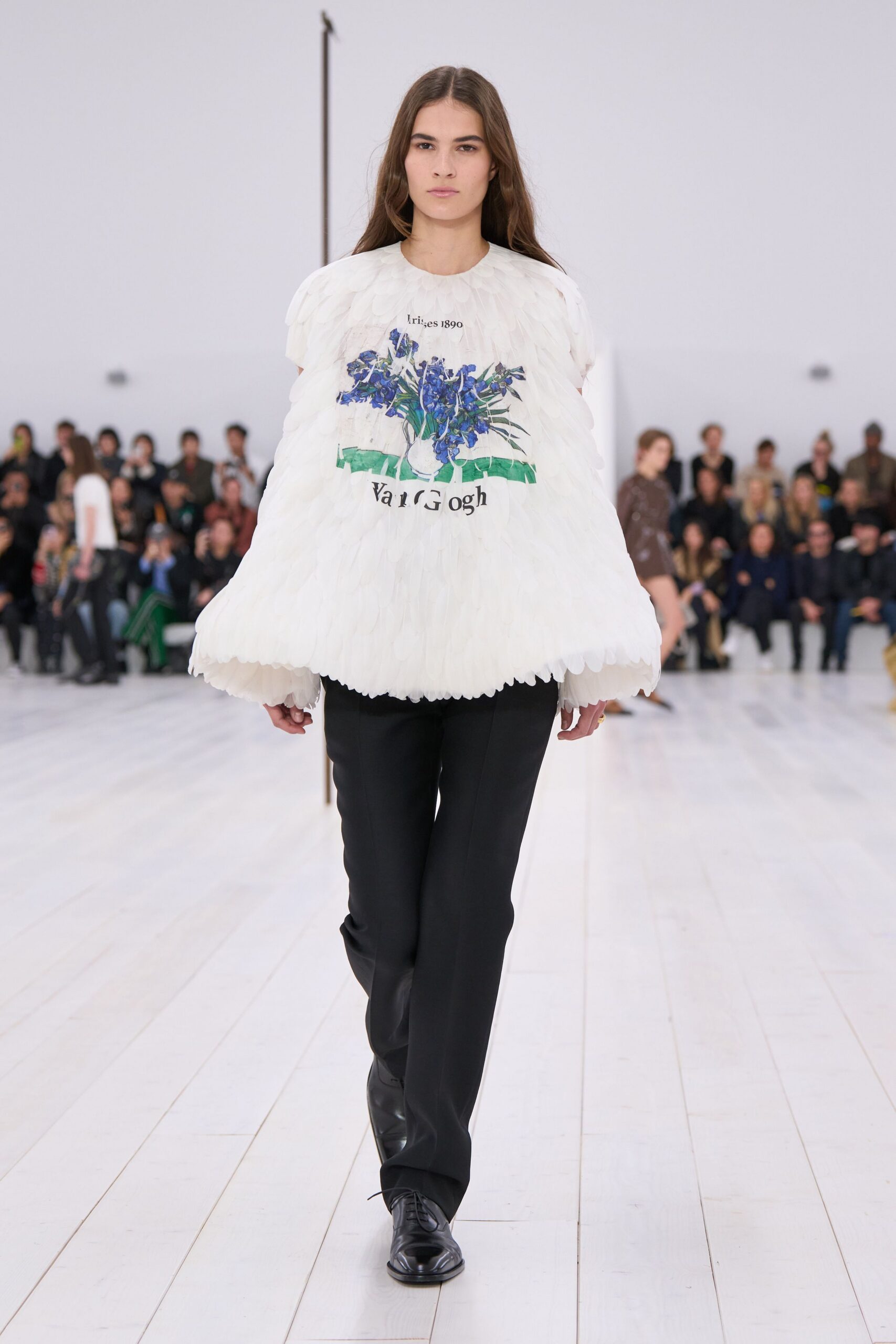 white embroidered top with black pants