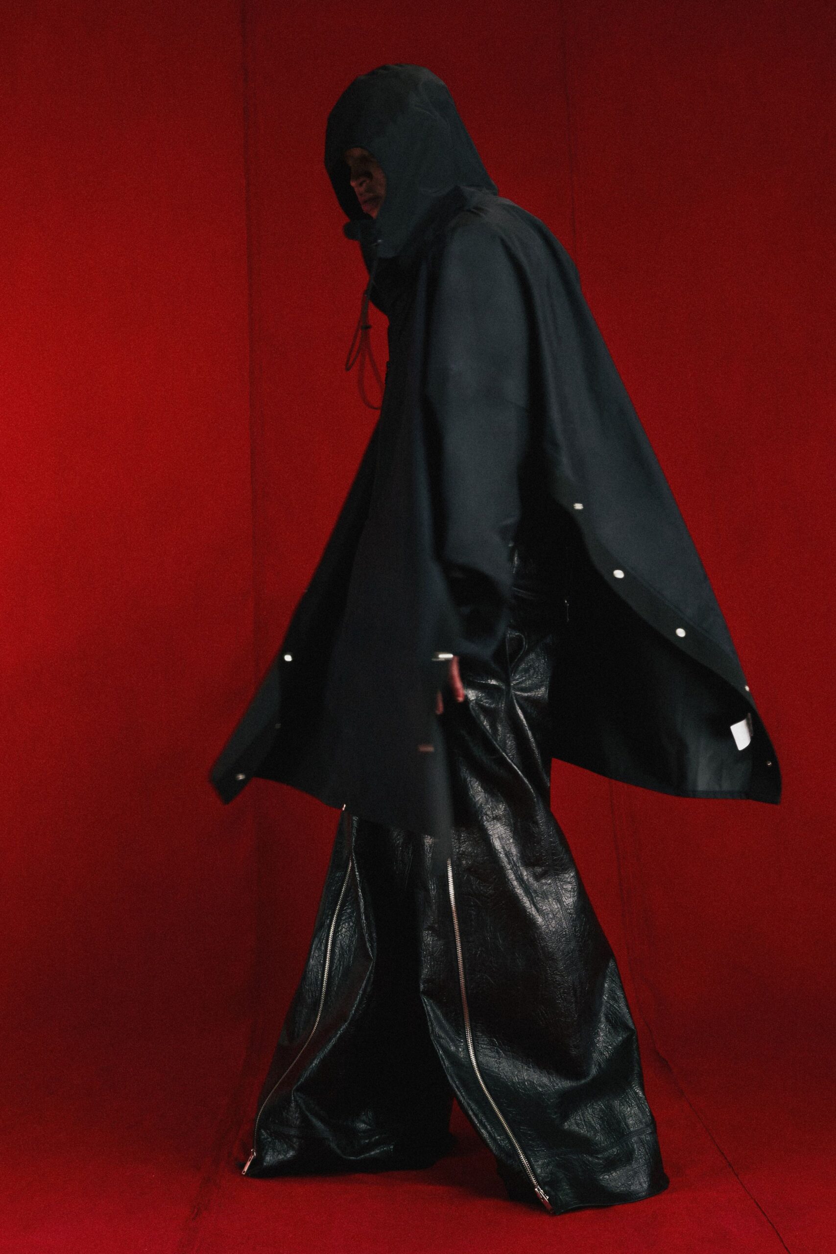 black hooded coat and leather pants