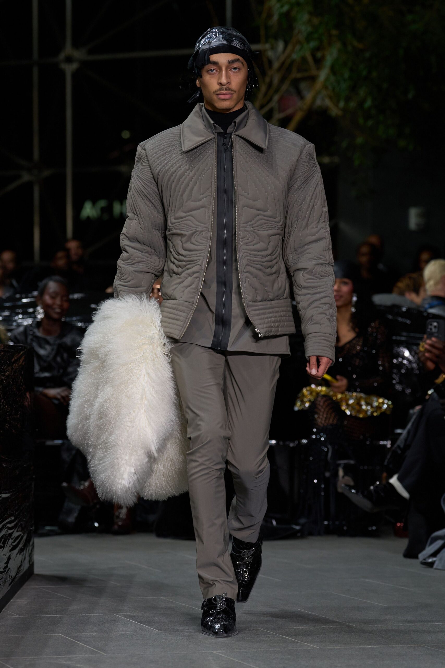 gray quilted jacket with black shirt