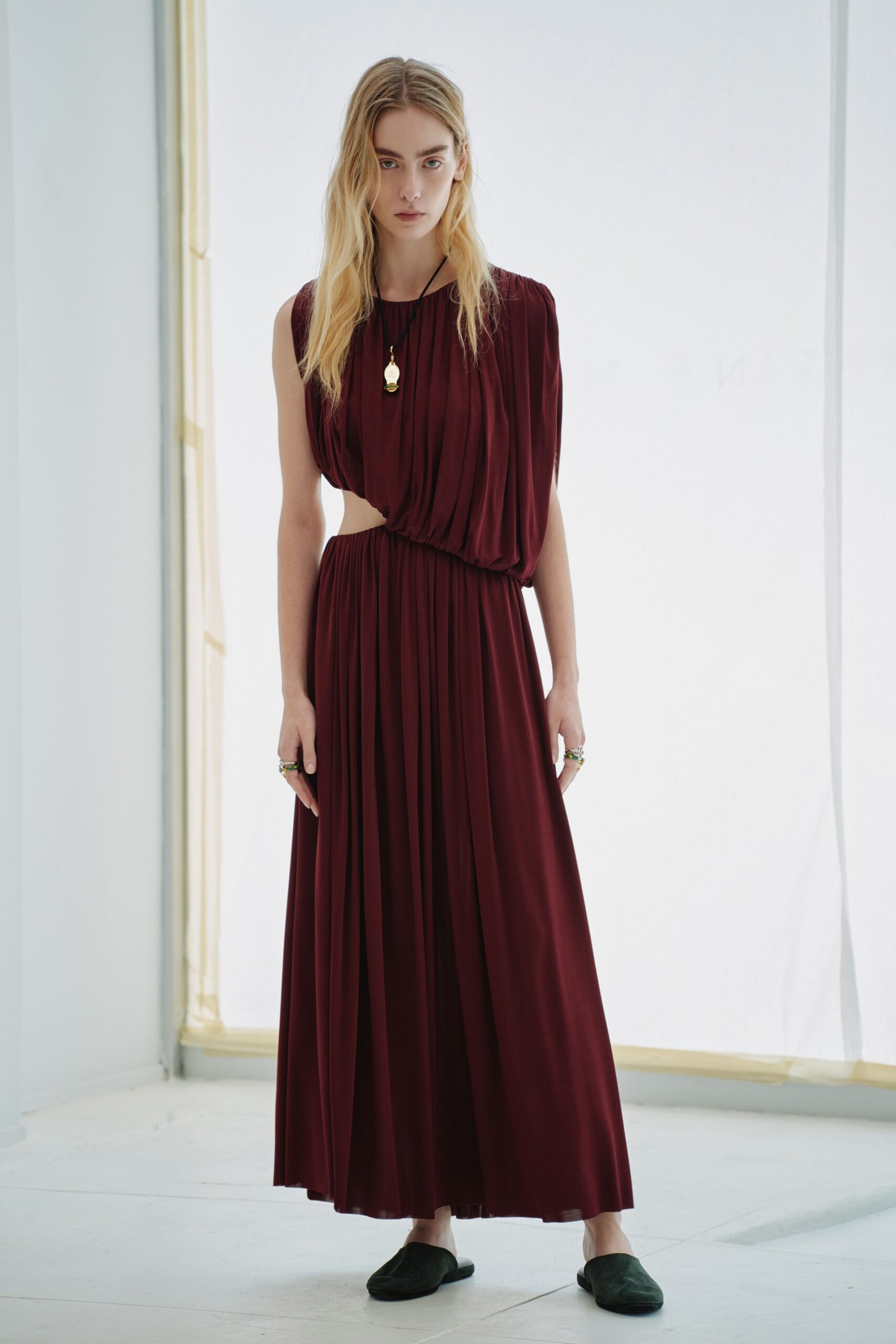 maroon silk sleeveless high-neck fitted pleated draped gown
