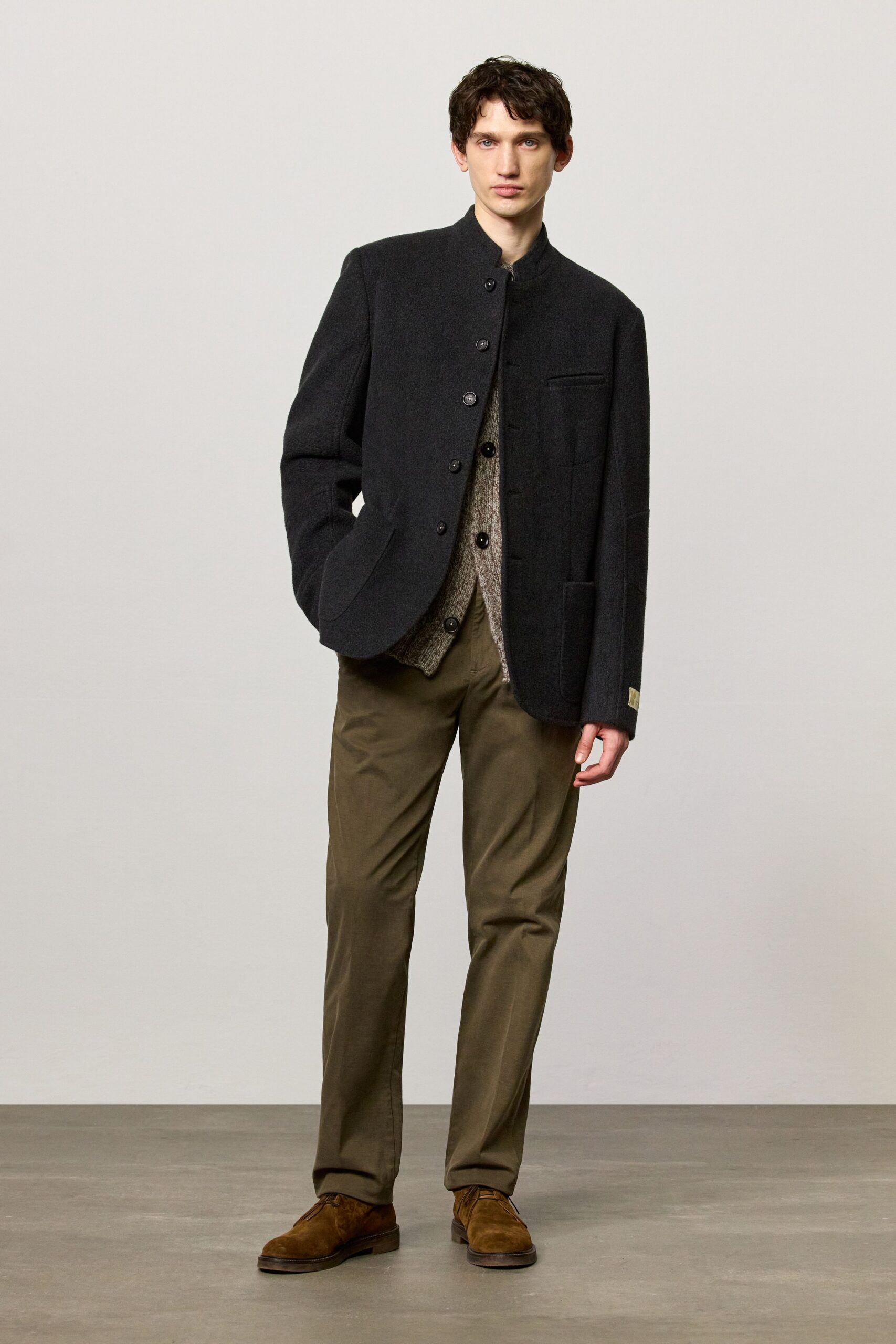 black wool jacket beige shirt brown pants