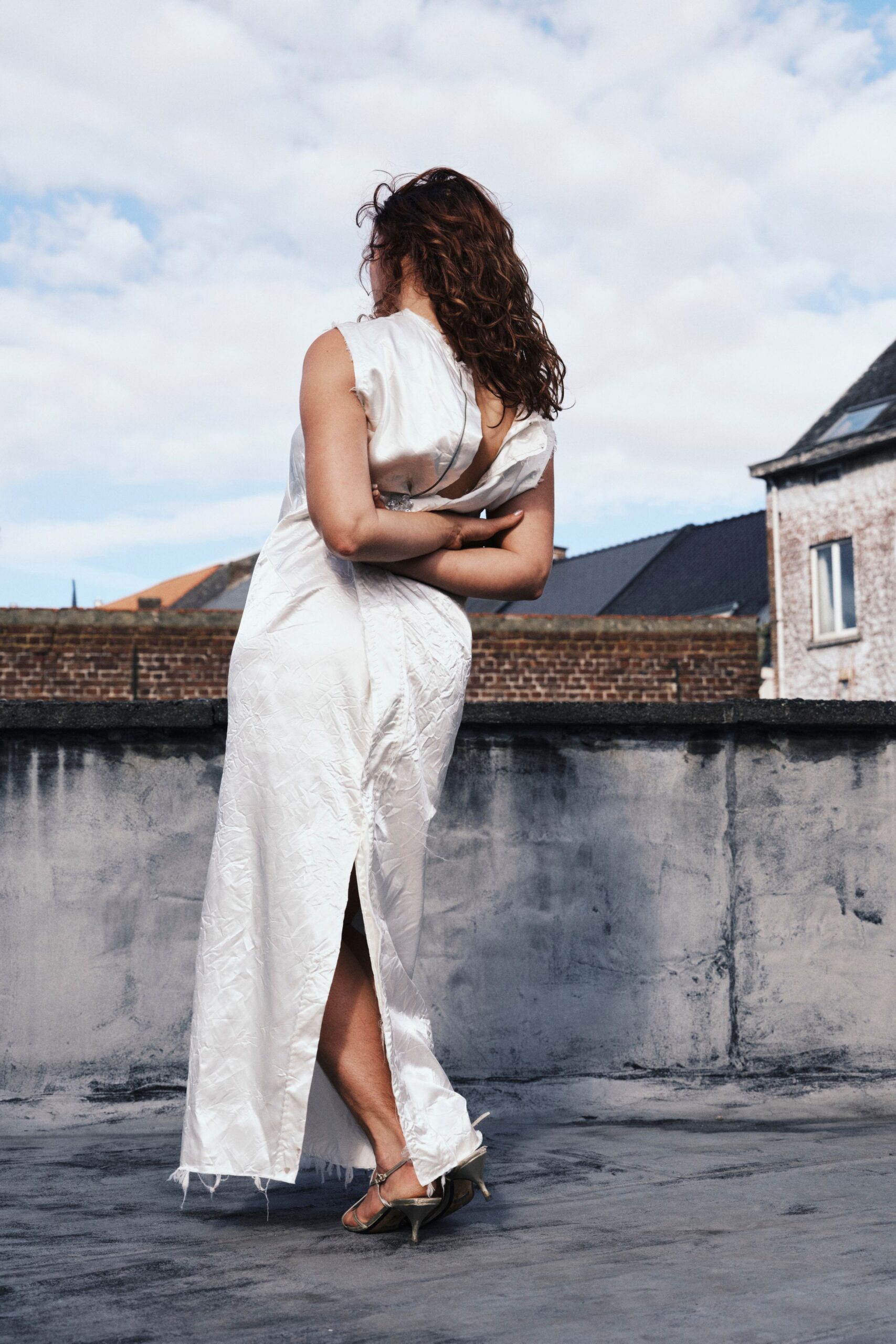 white silk fitted gown with slit