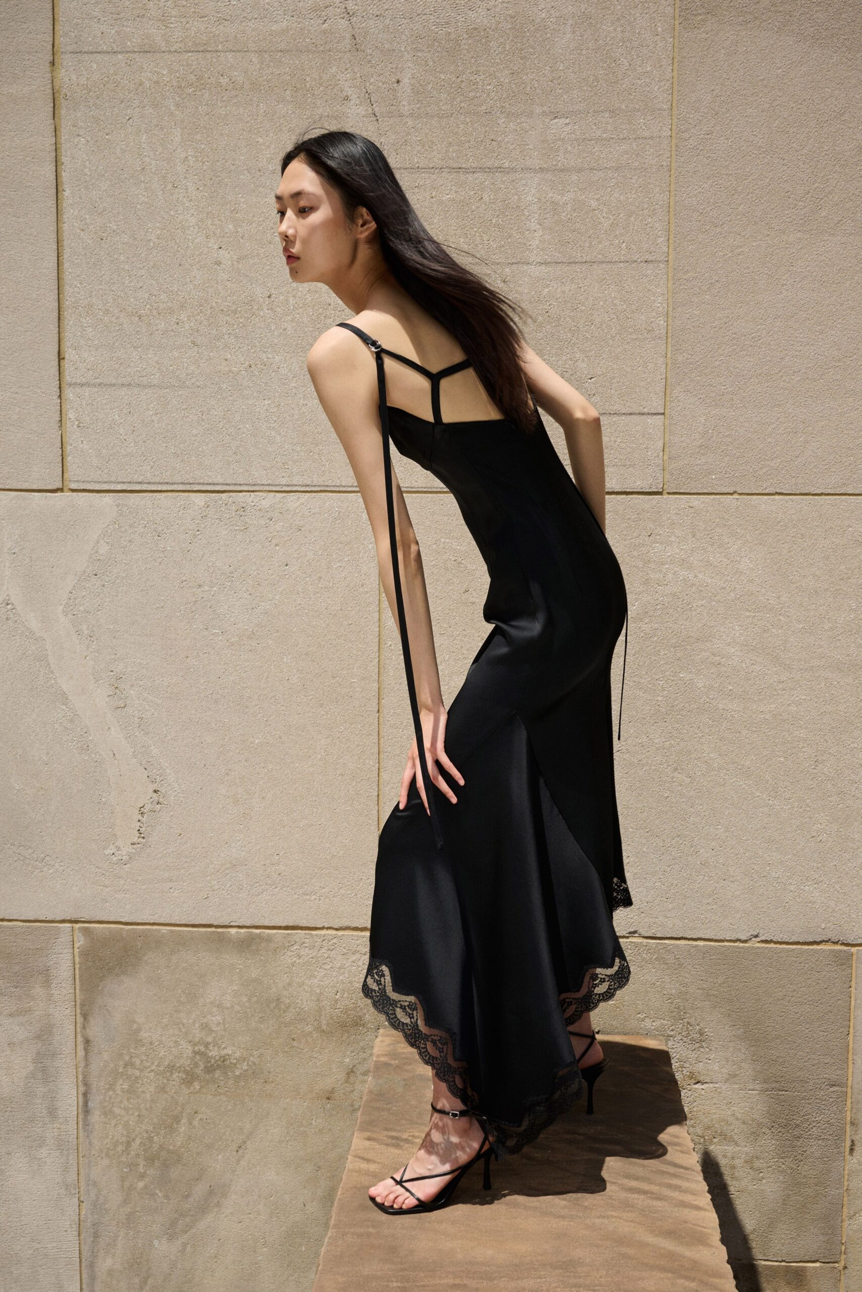 black silk midi dress with strappy shoes