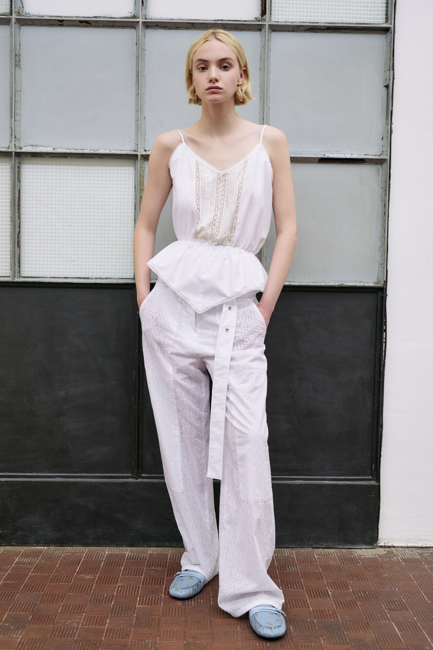 white embroidered top with relaxed pants