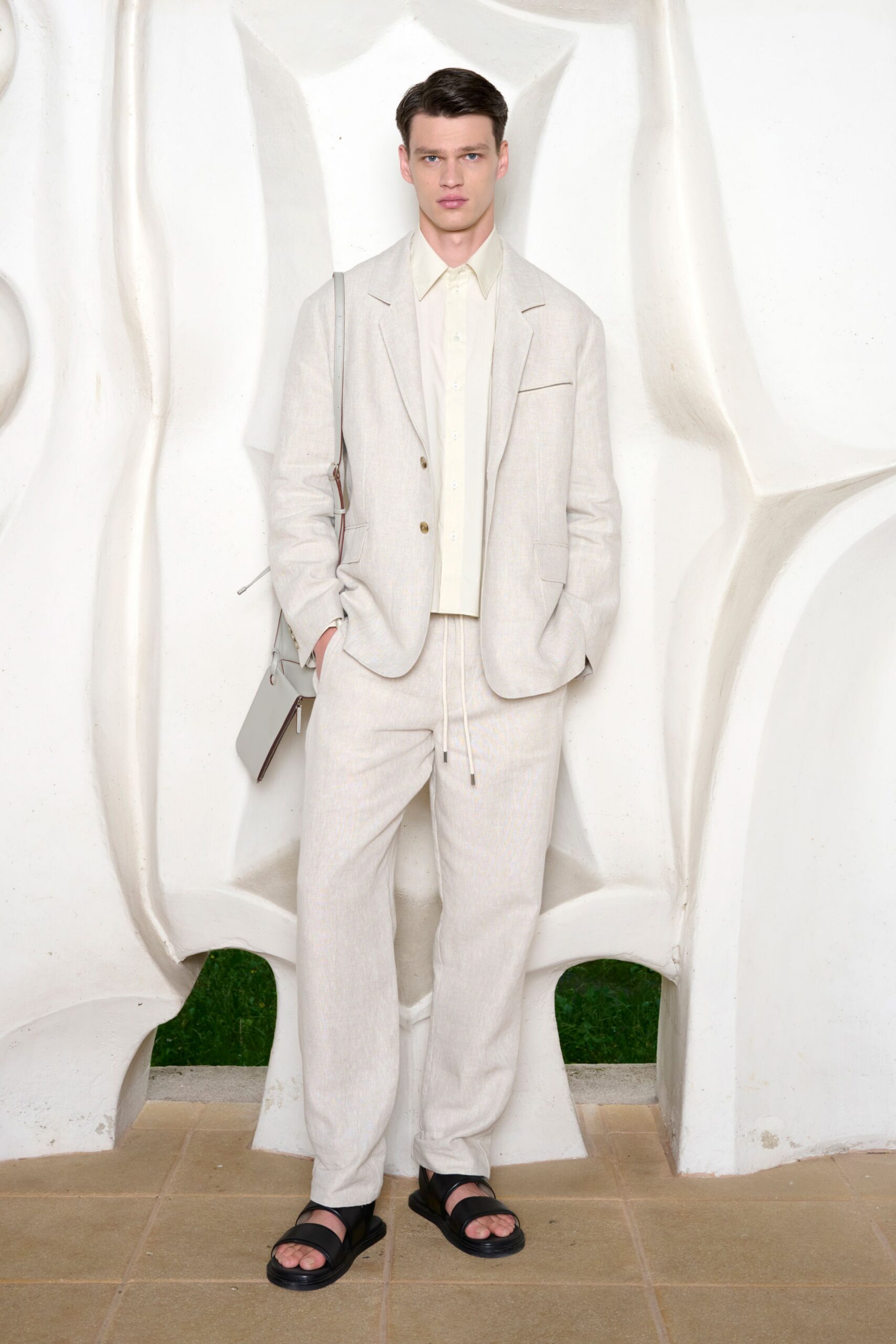 beige tailored suit with black shoes