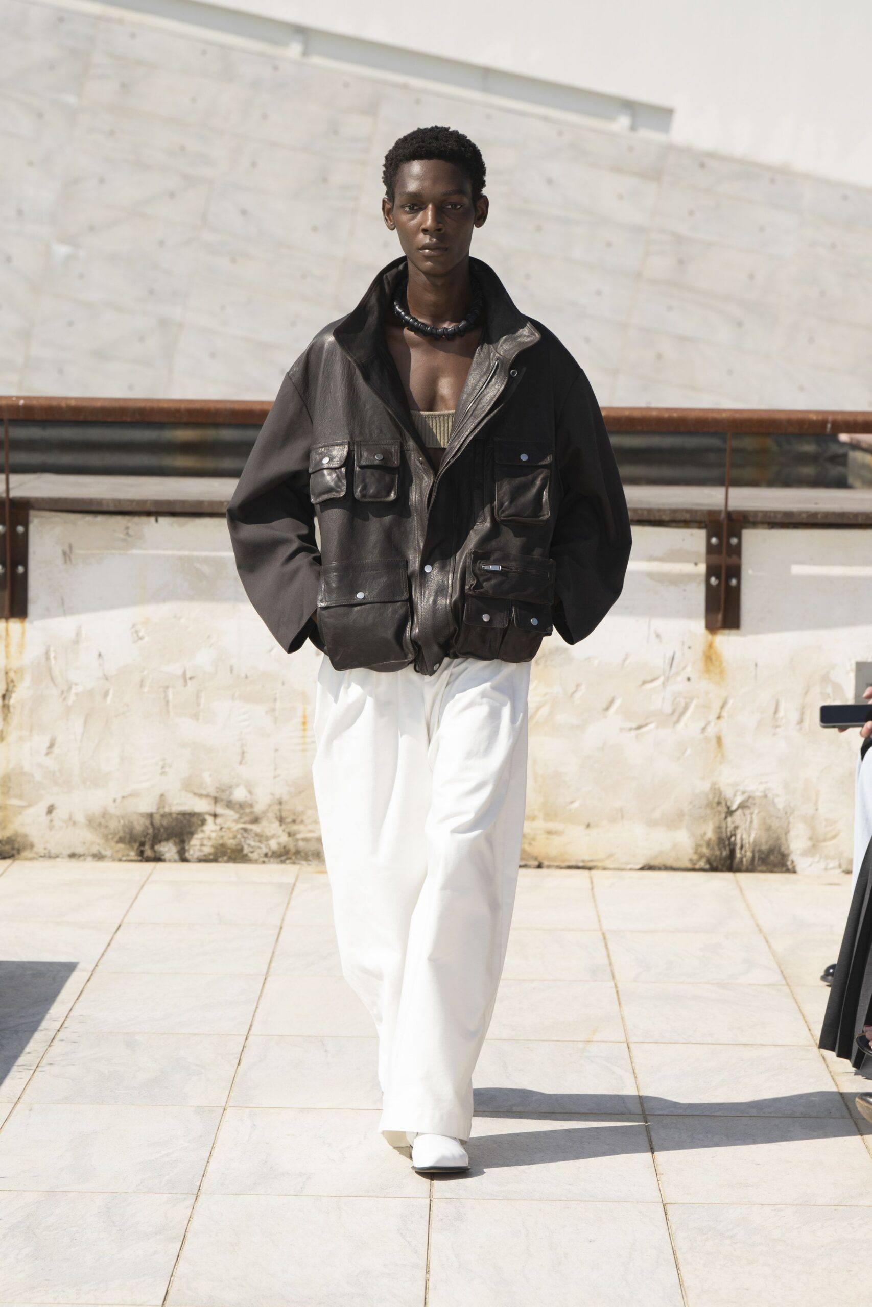 black leather oversized jacket with beige top