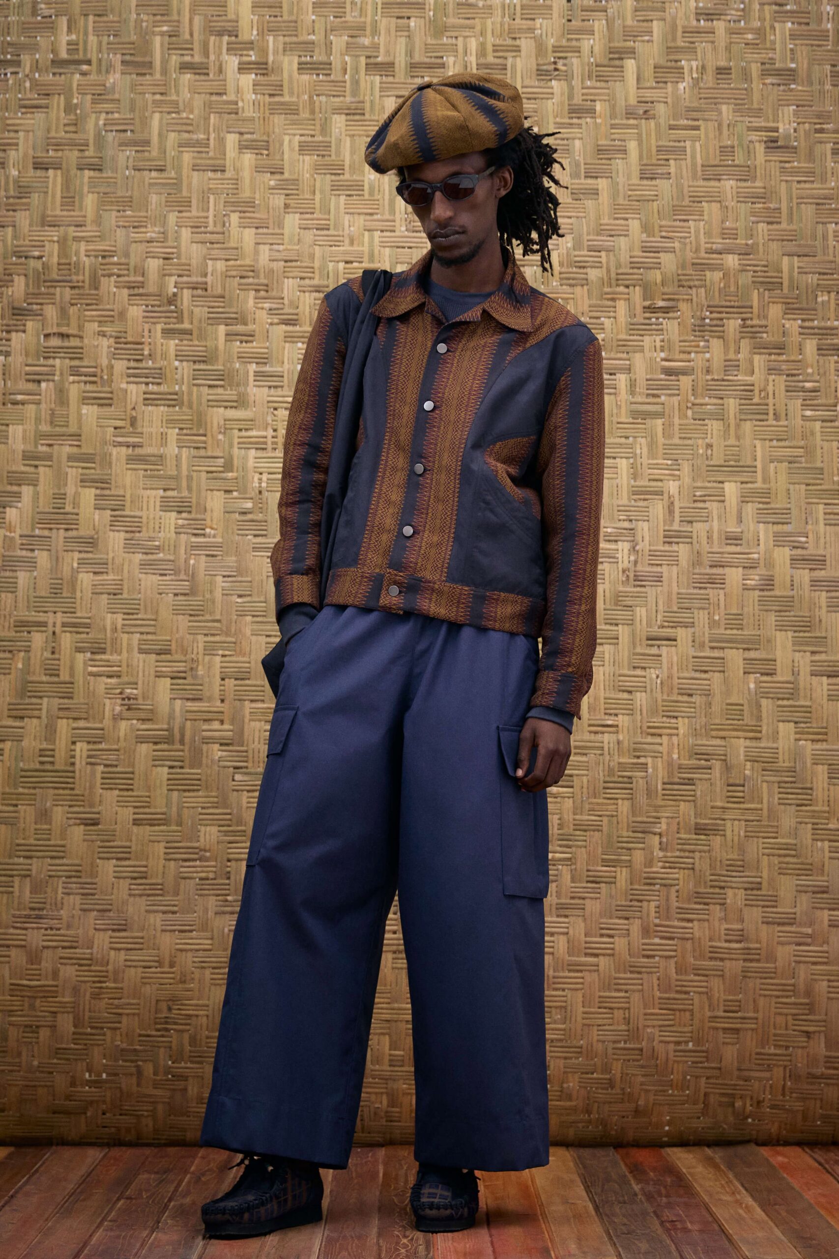 brown striped jacket with blue pants