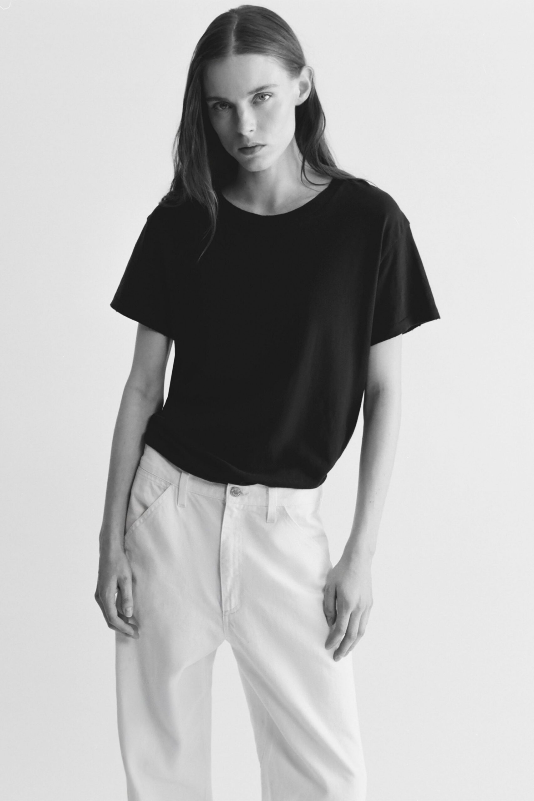 black t-shirt and white pants