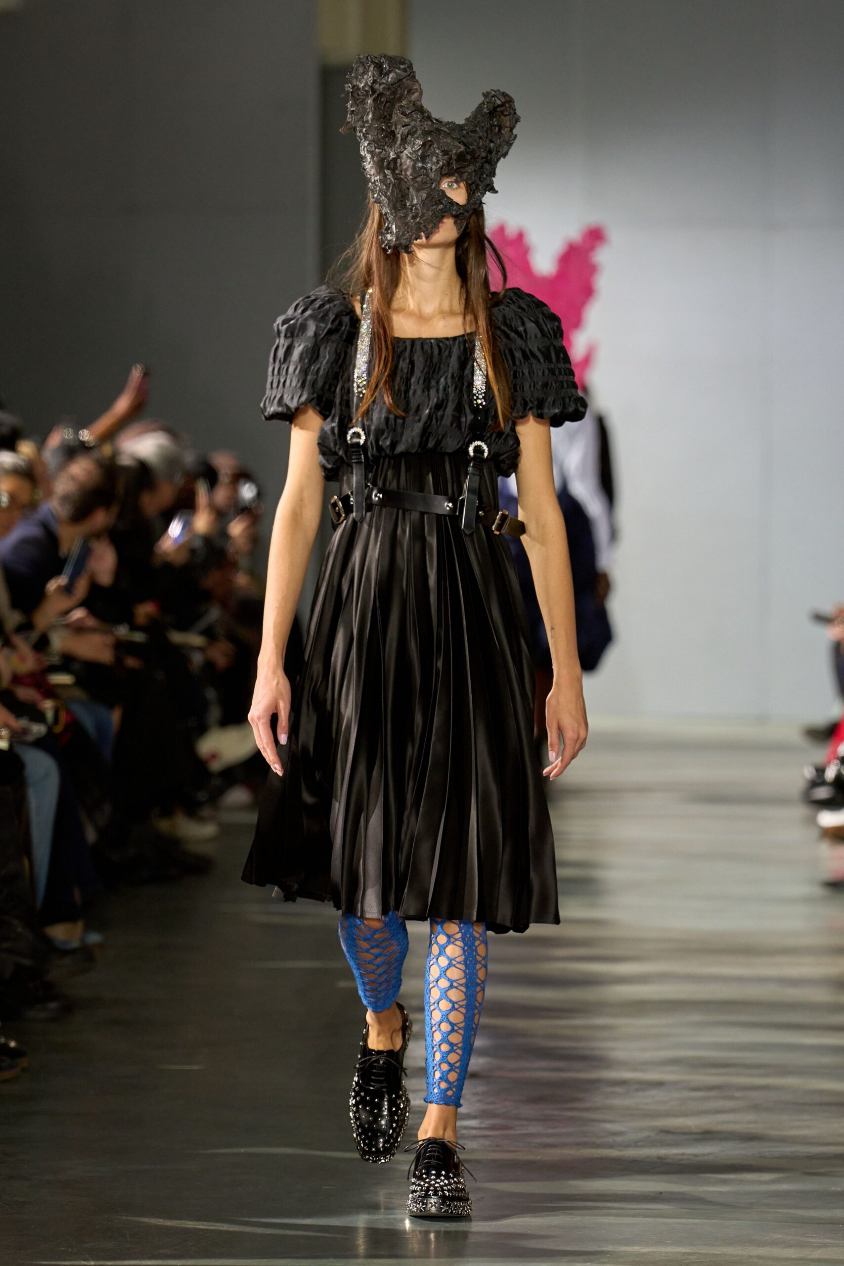 black pleated midi dress with blue pants