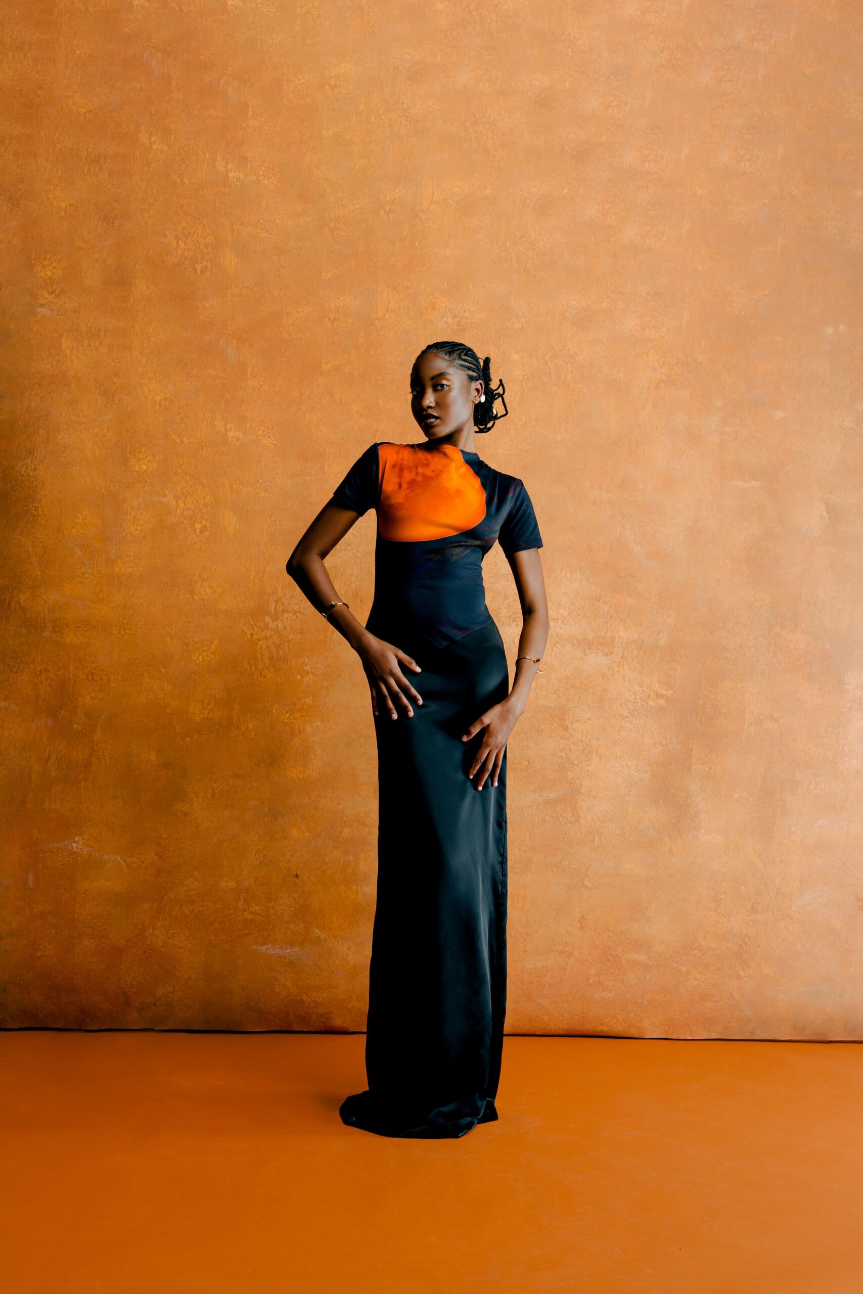 black and orange color-blocked gown