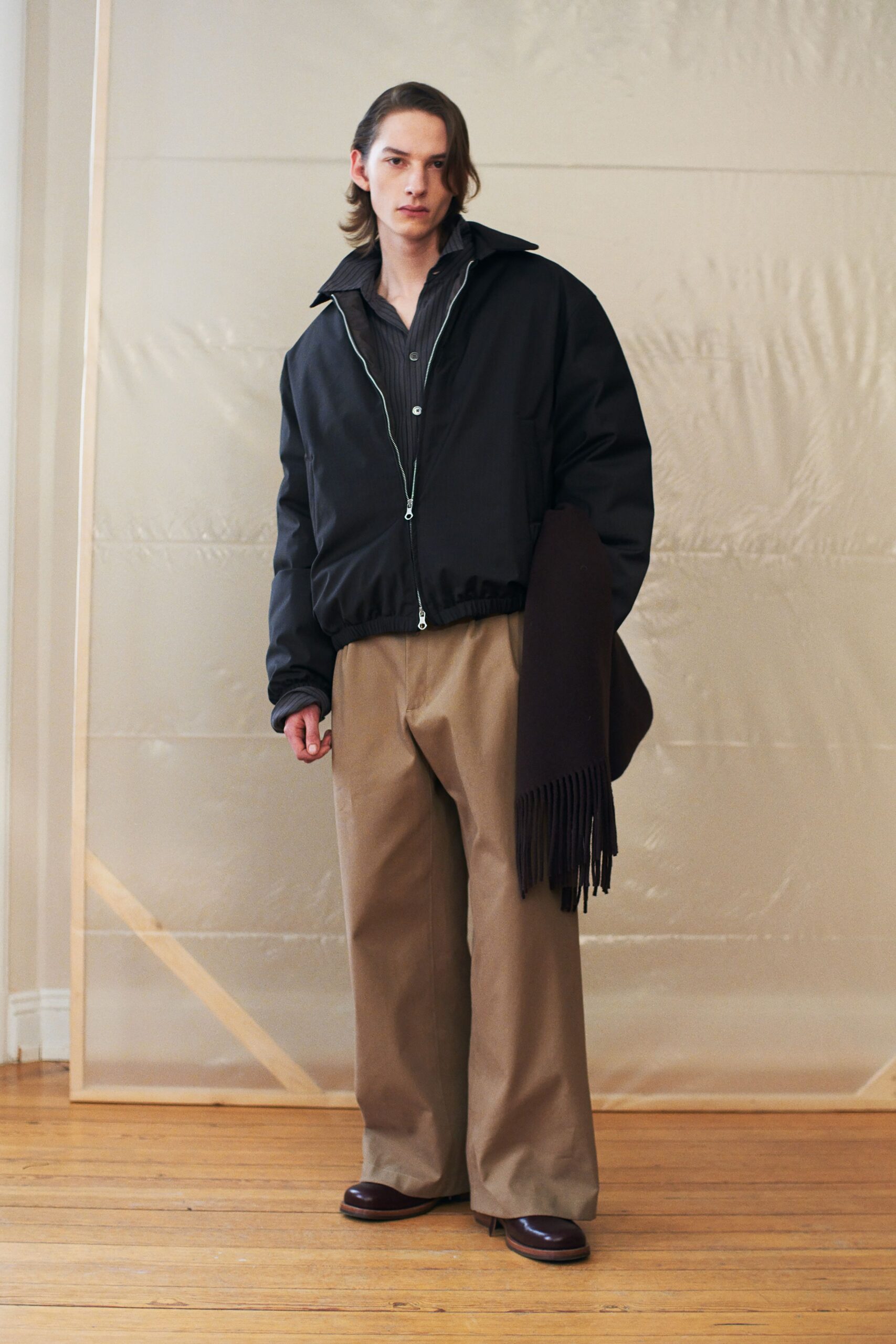 black jacket beige pants outfit