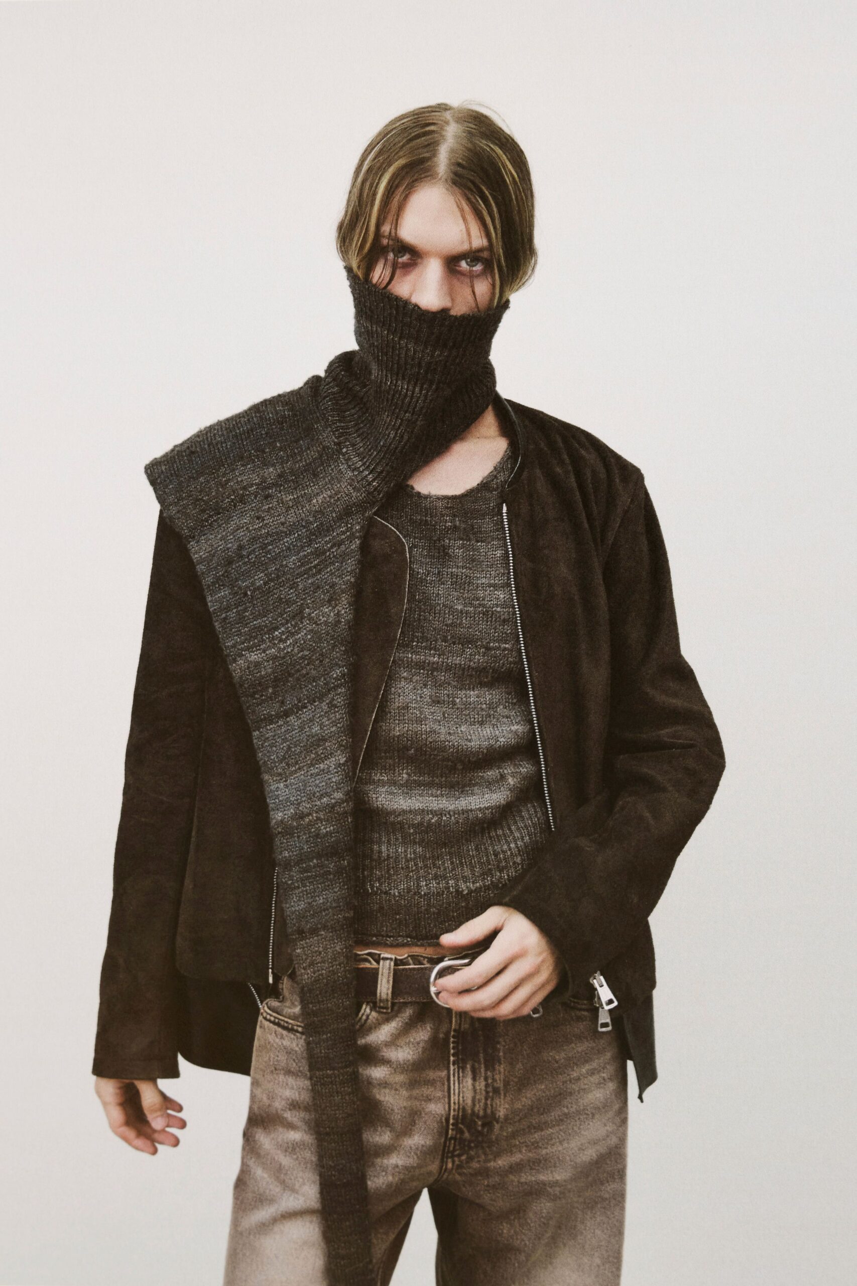brown suede jacket gray sweater beige pants