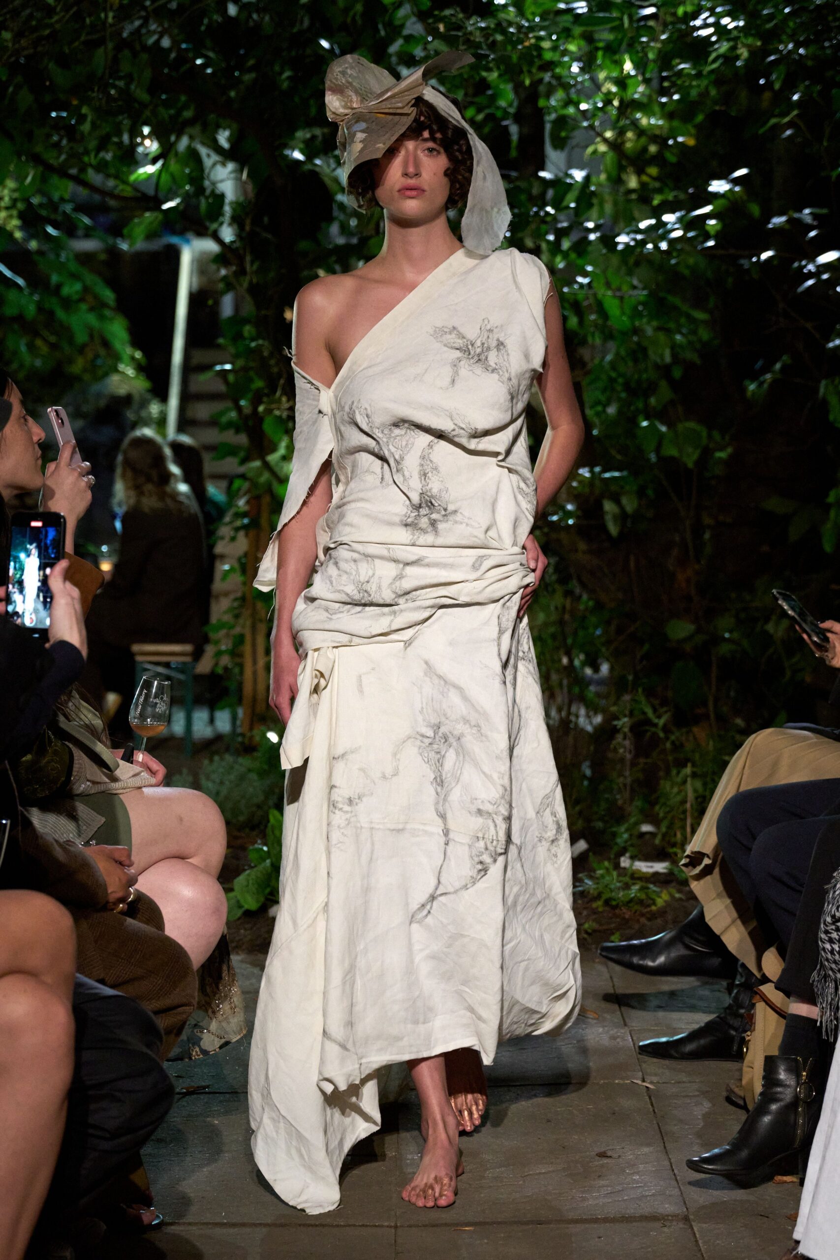 white cotton sleeveless off-shoulder fitted draped flowing gown
