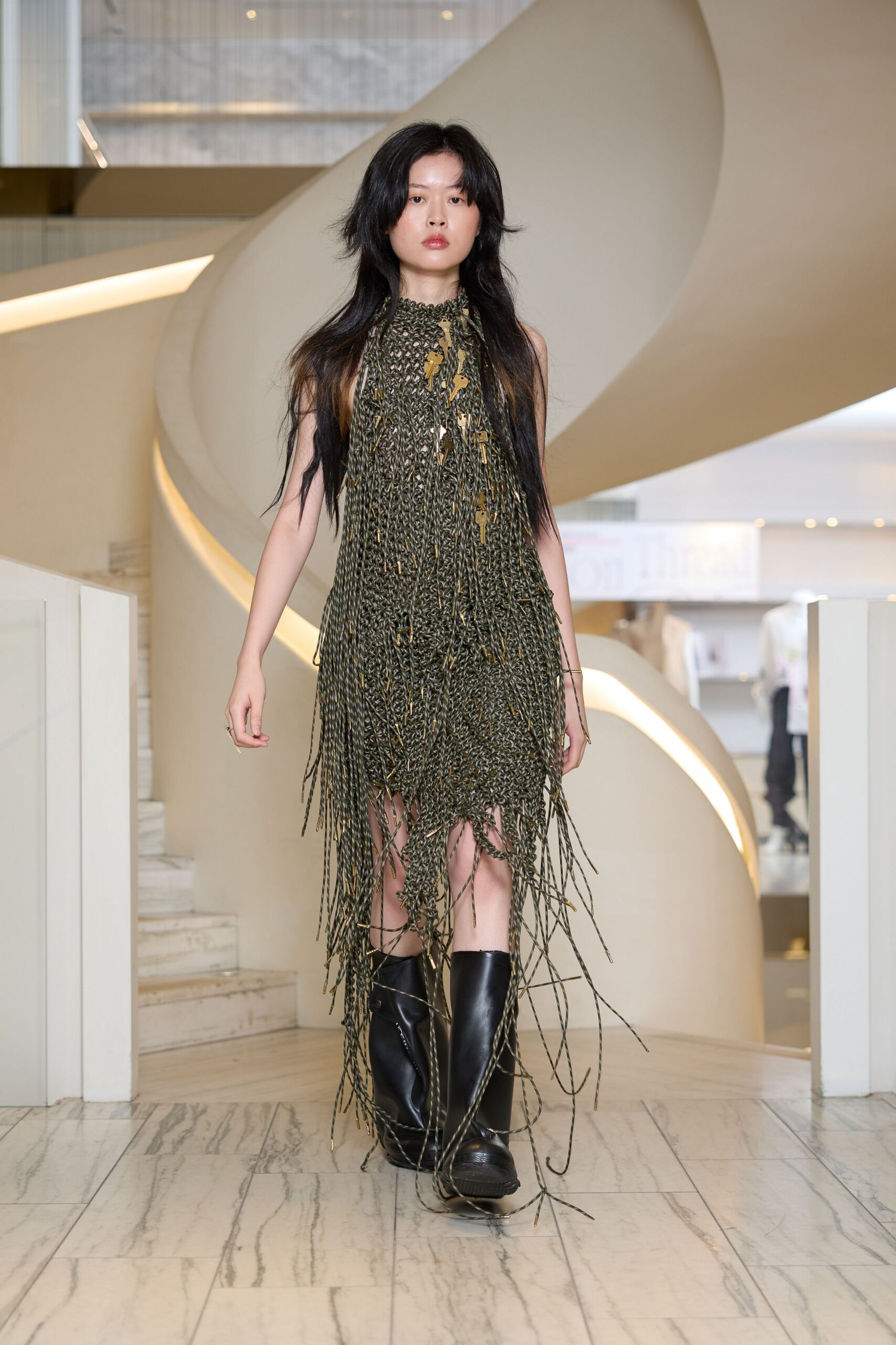 fringed green mini dress with black boots