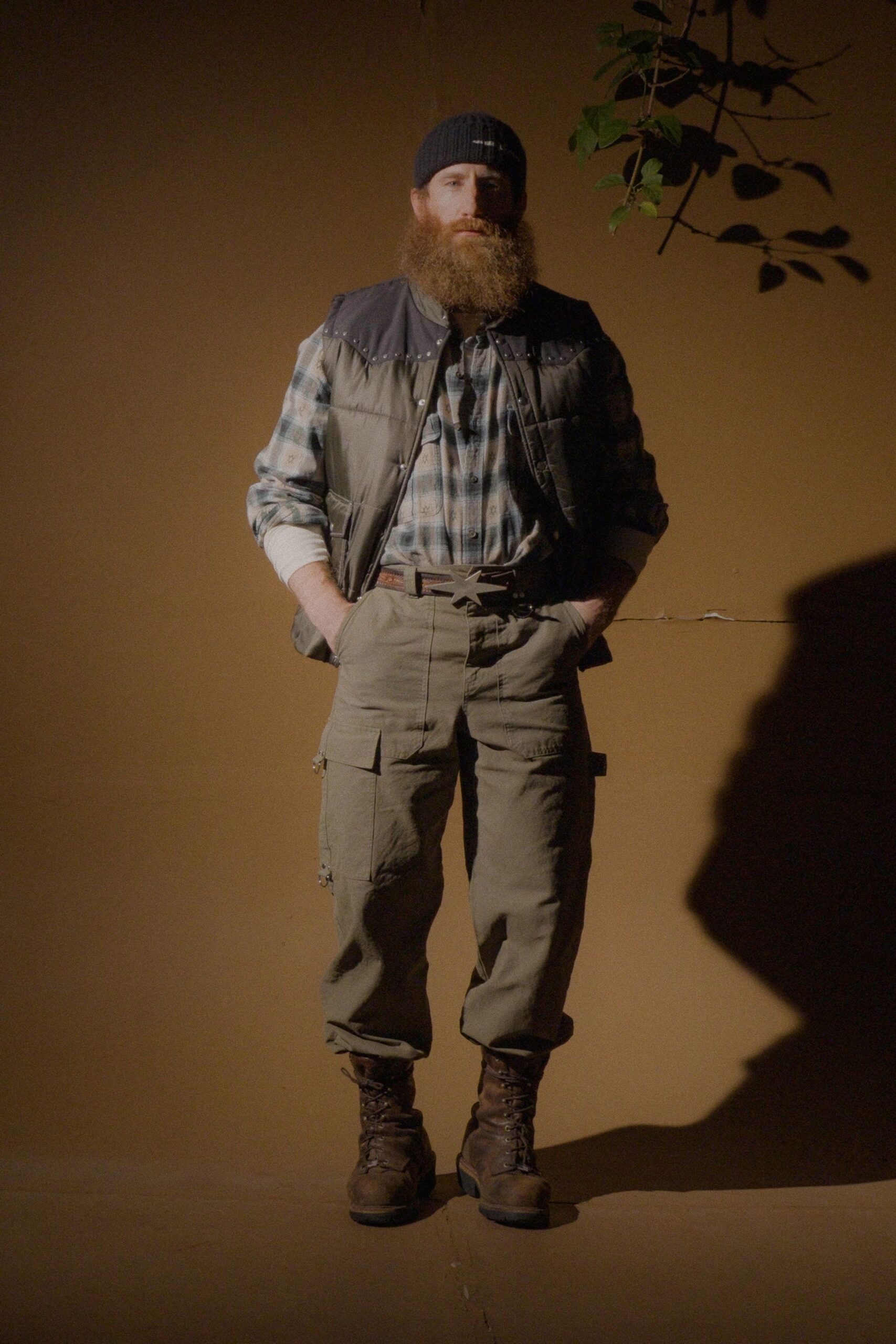 gray vest blue checked shirt green cargo pants