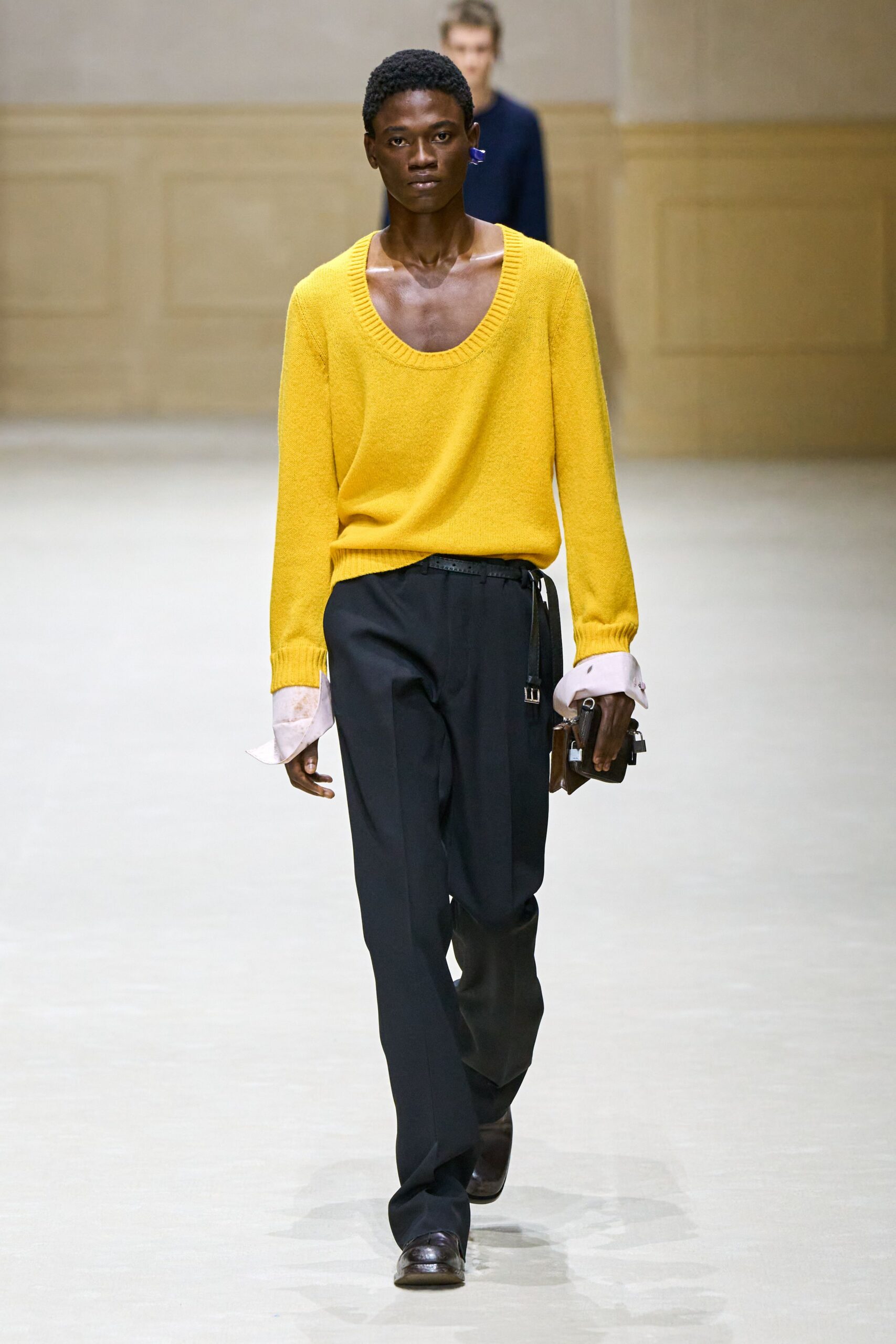 yellow wool sweater with black pants
