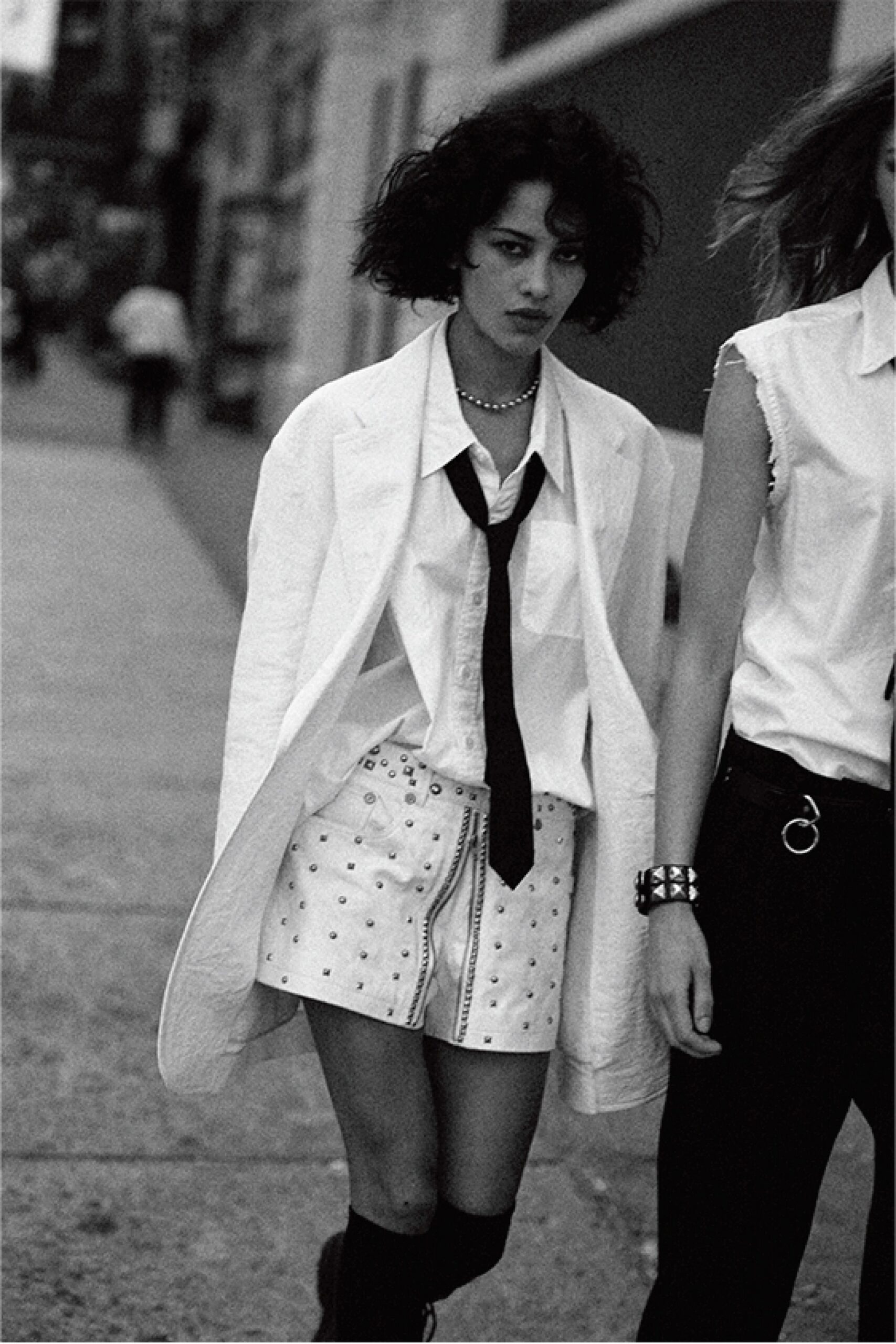 white blazer black tie mini skirt