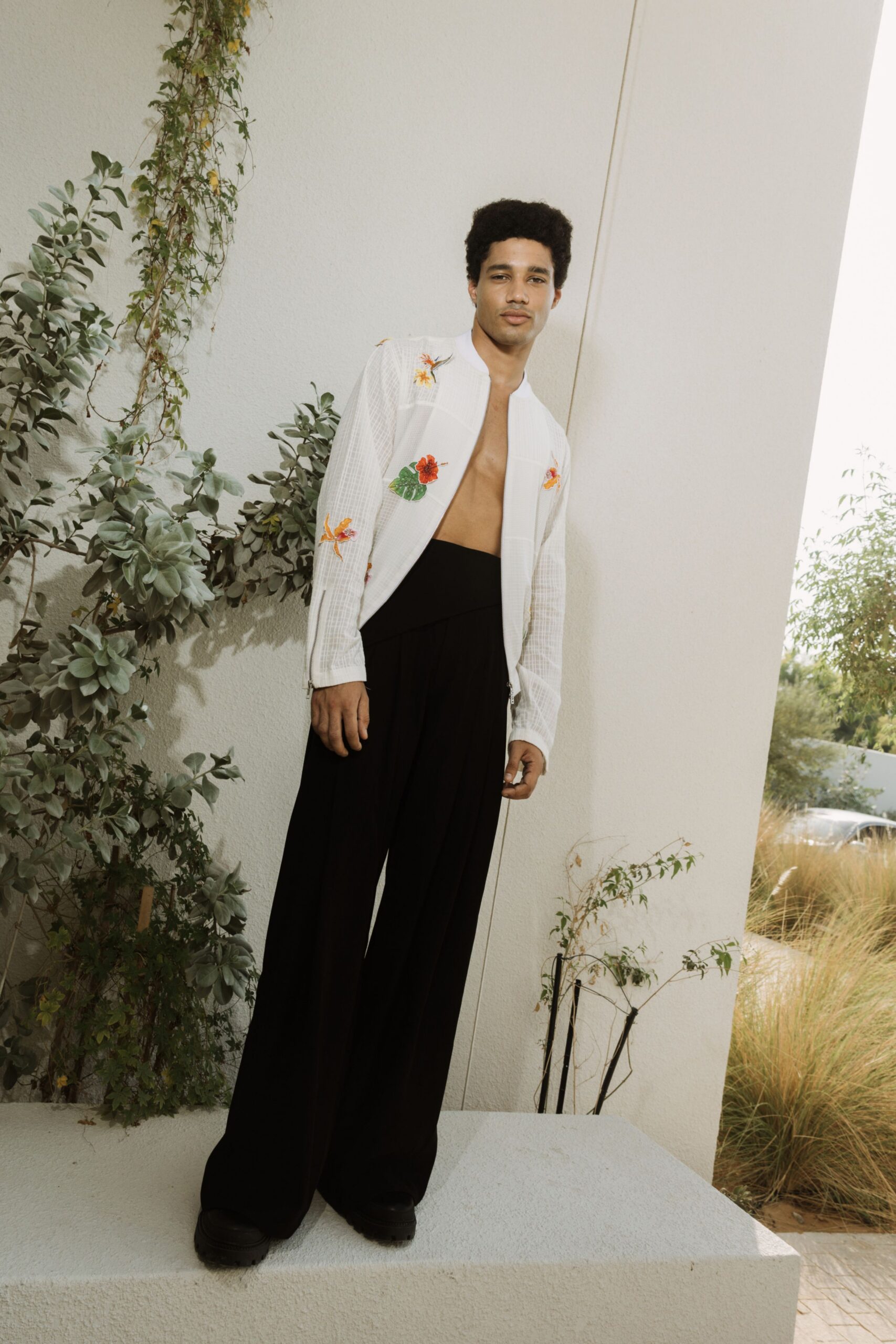 white embroidered jacket black pants