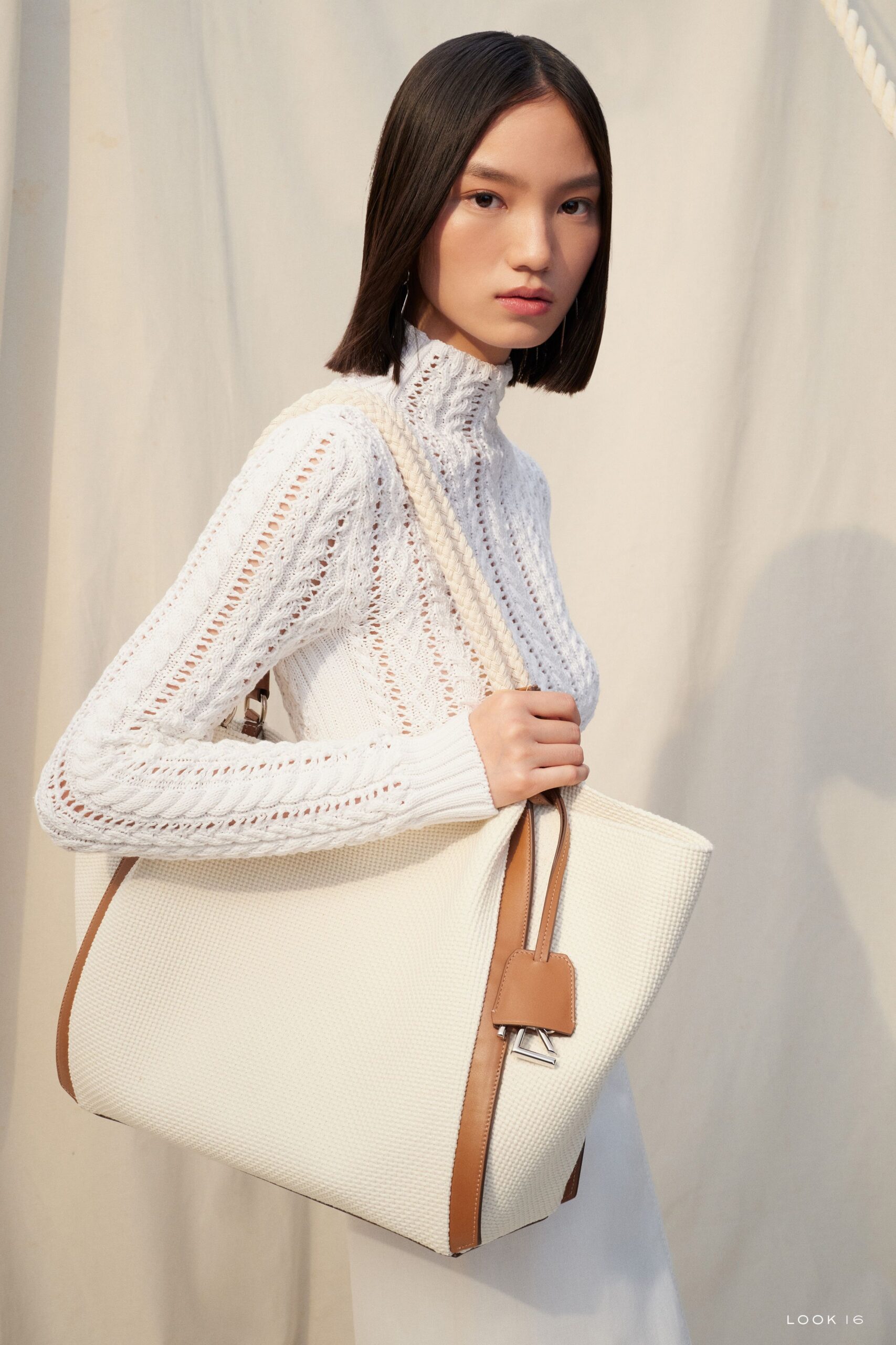 white fitted sweater and bag