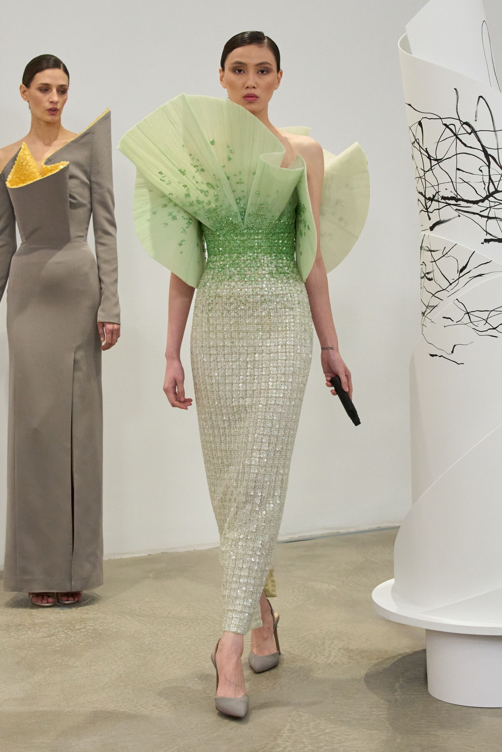 green sequin sleeveless off-shoulder fitted pleated embellished gown