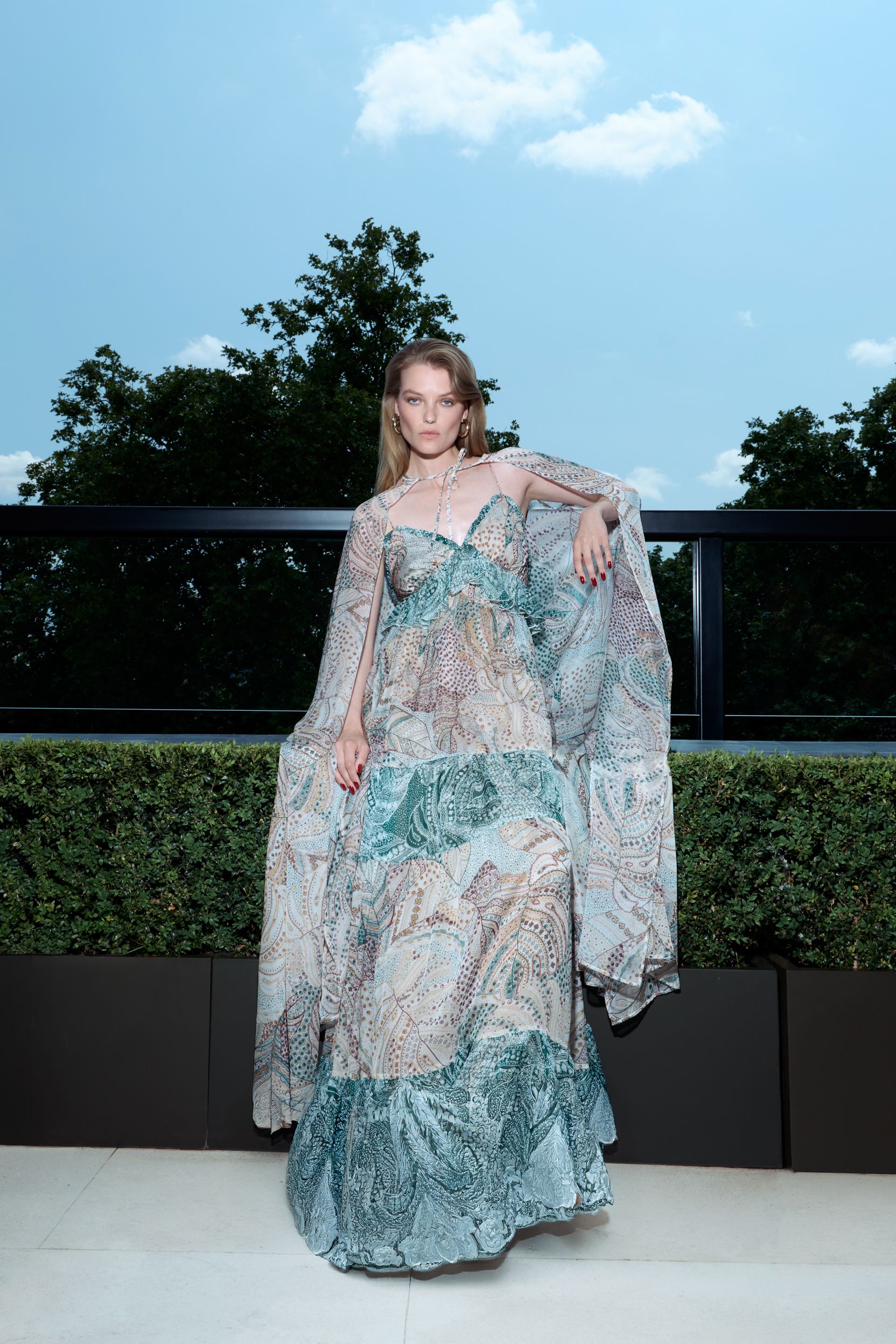 blue silk sleeveless v-neck fitted layered flared gown