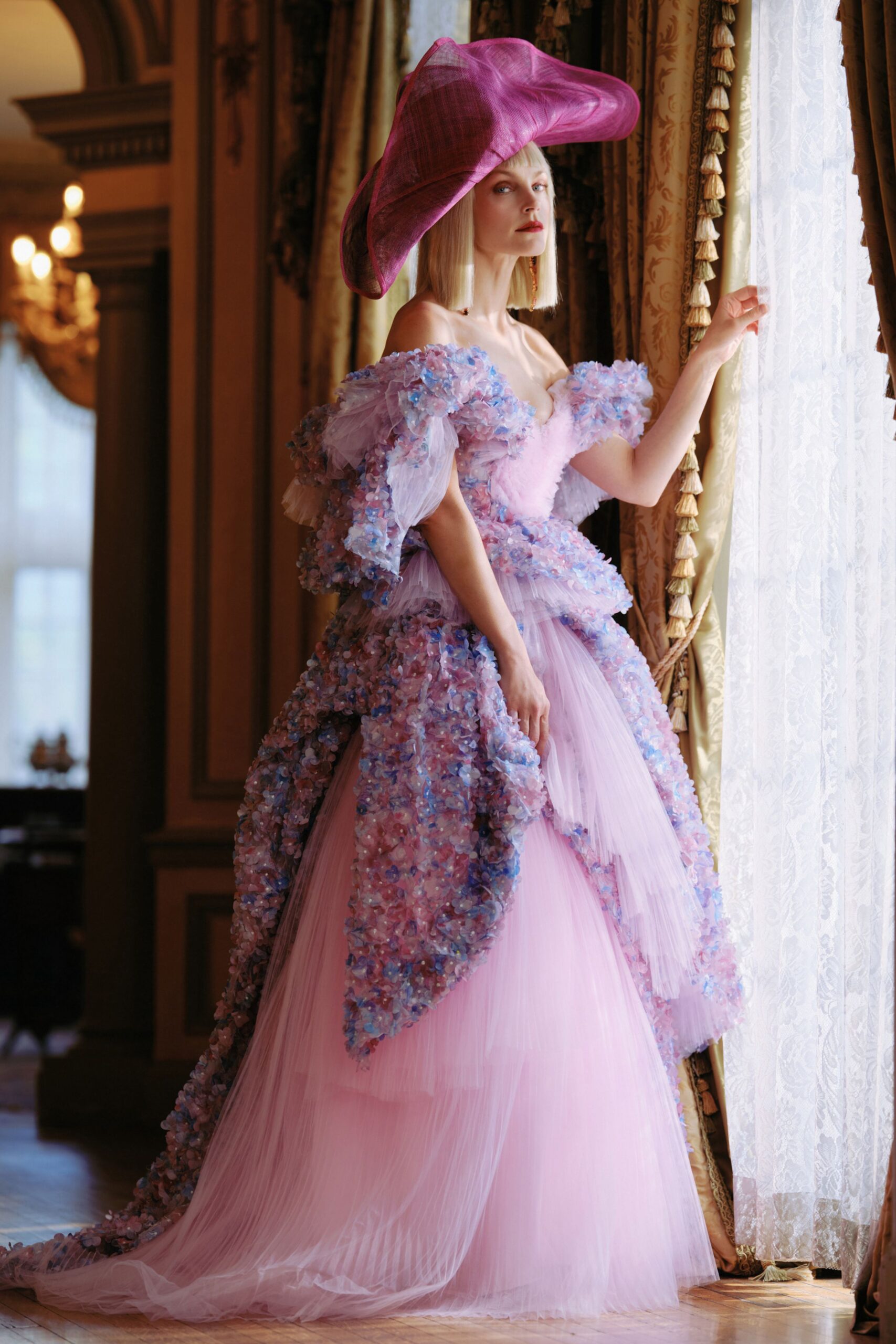 pink tulle off-shoulder fitted ruffled layered flowing gown
